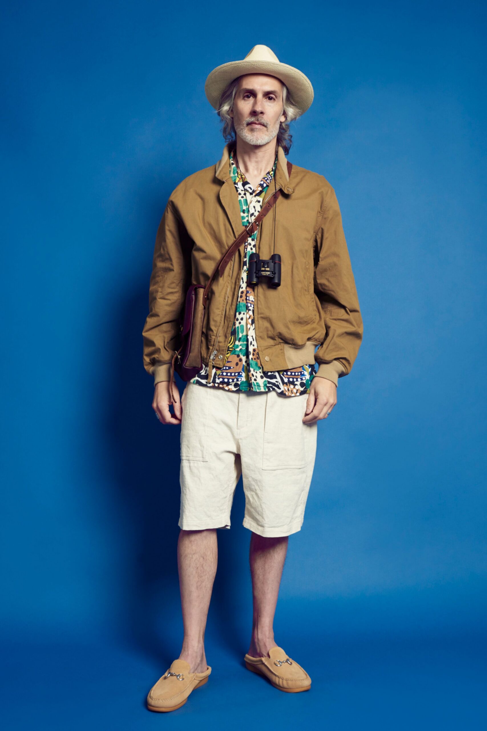 brown jacket with multi-colored shirt