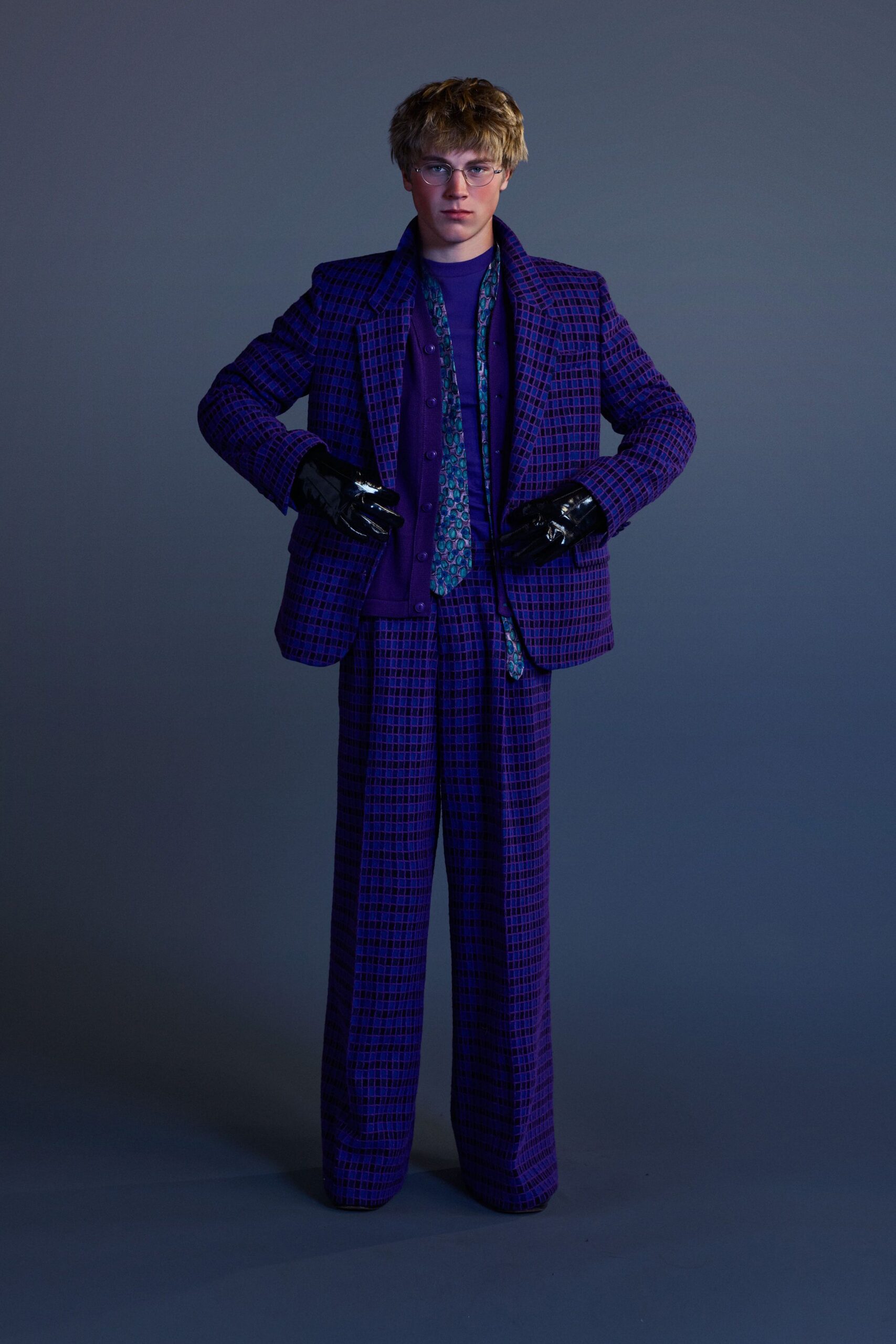 purple tailored suit with gloves