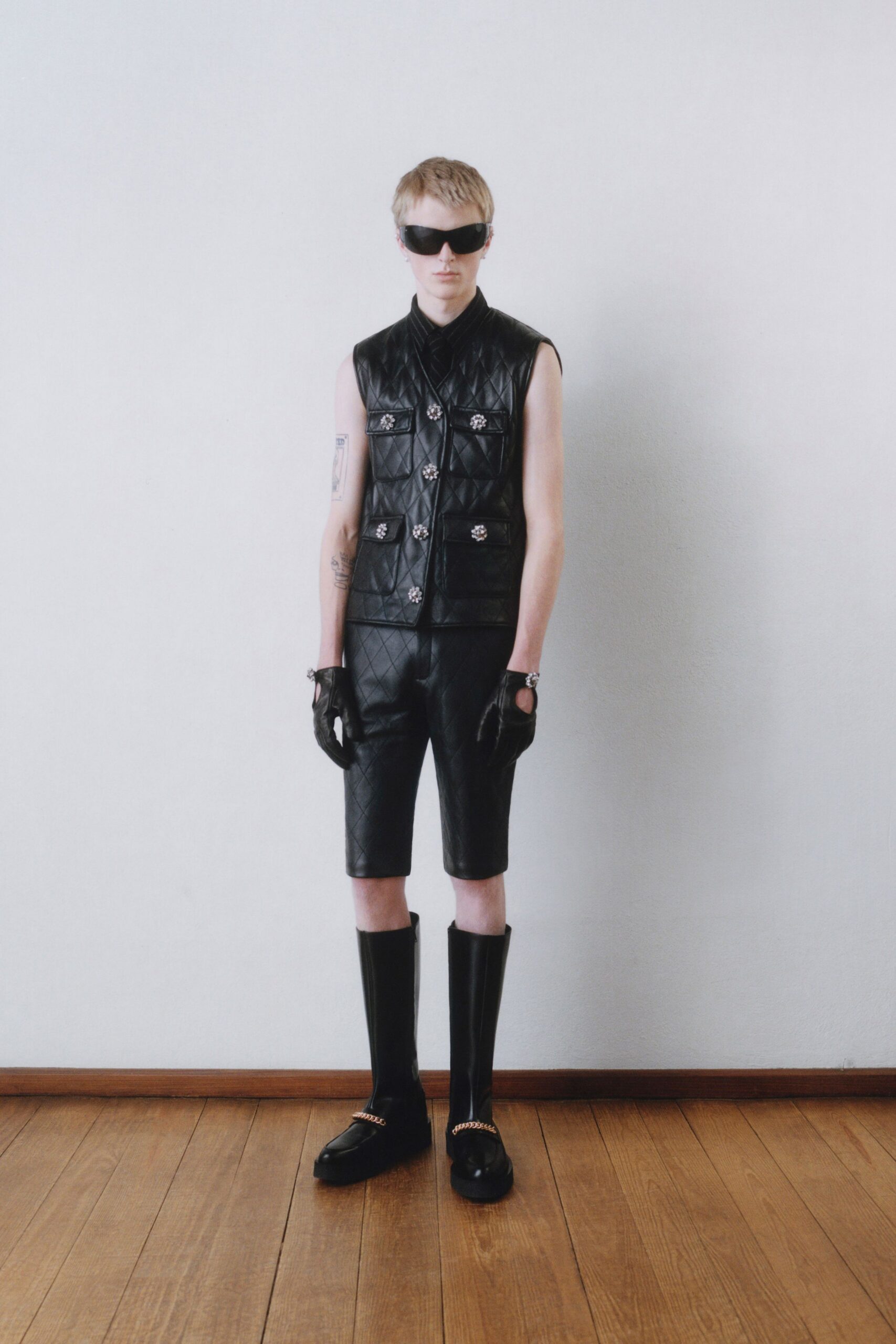 black leather vest and shorts
