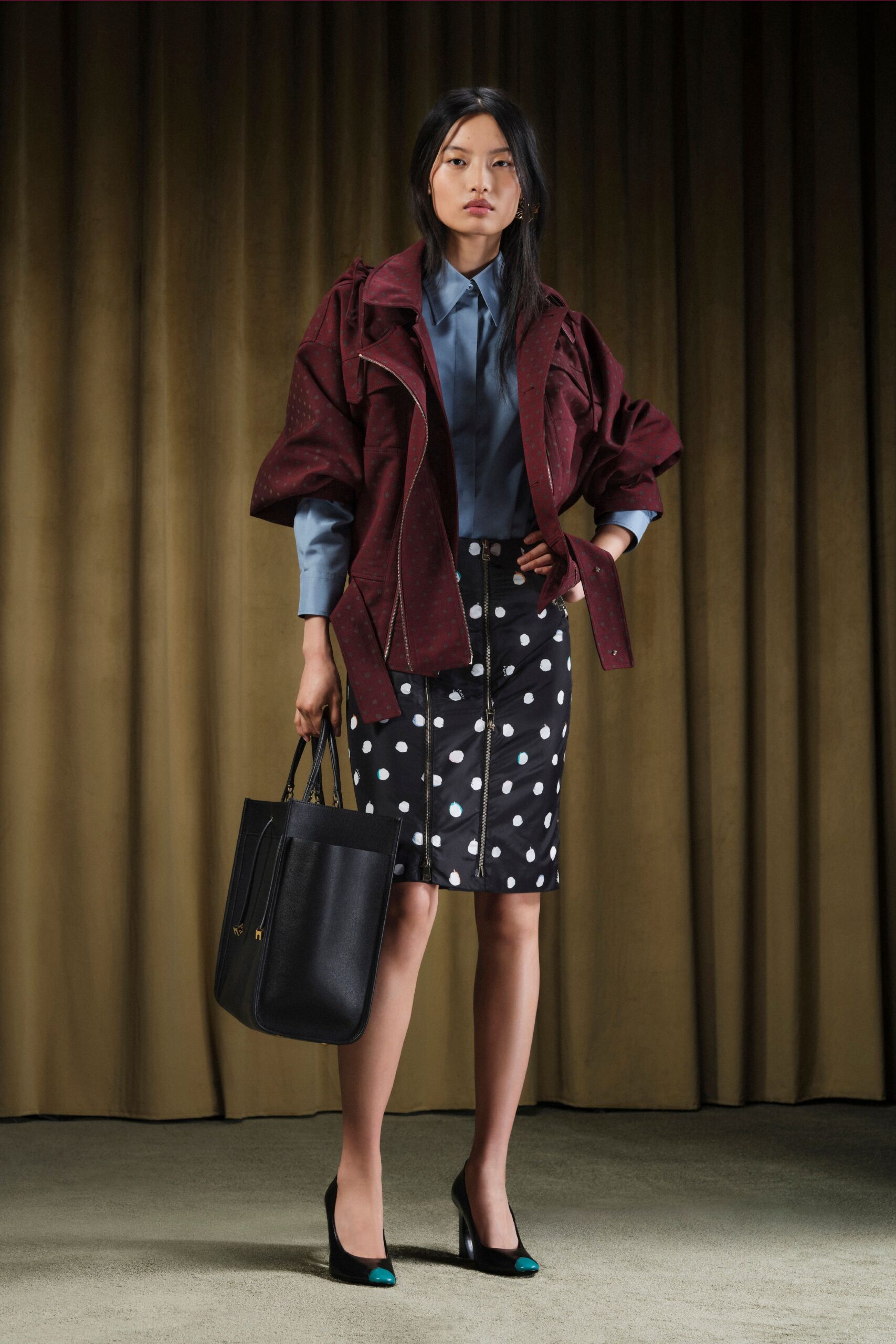 red relaxed jacket blue shirt polka-dot skirt