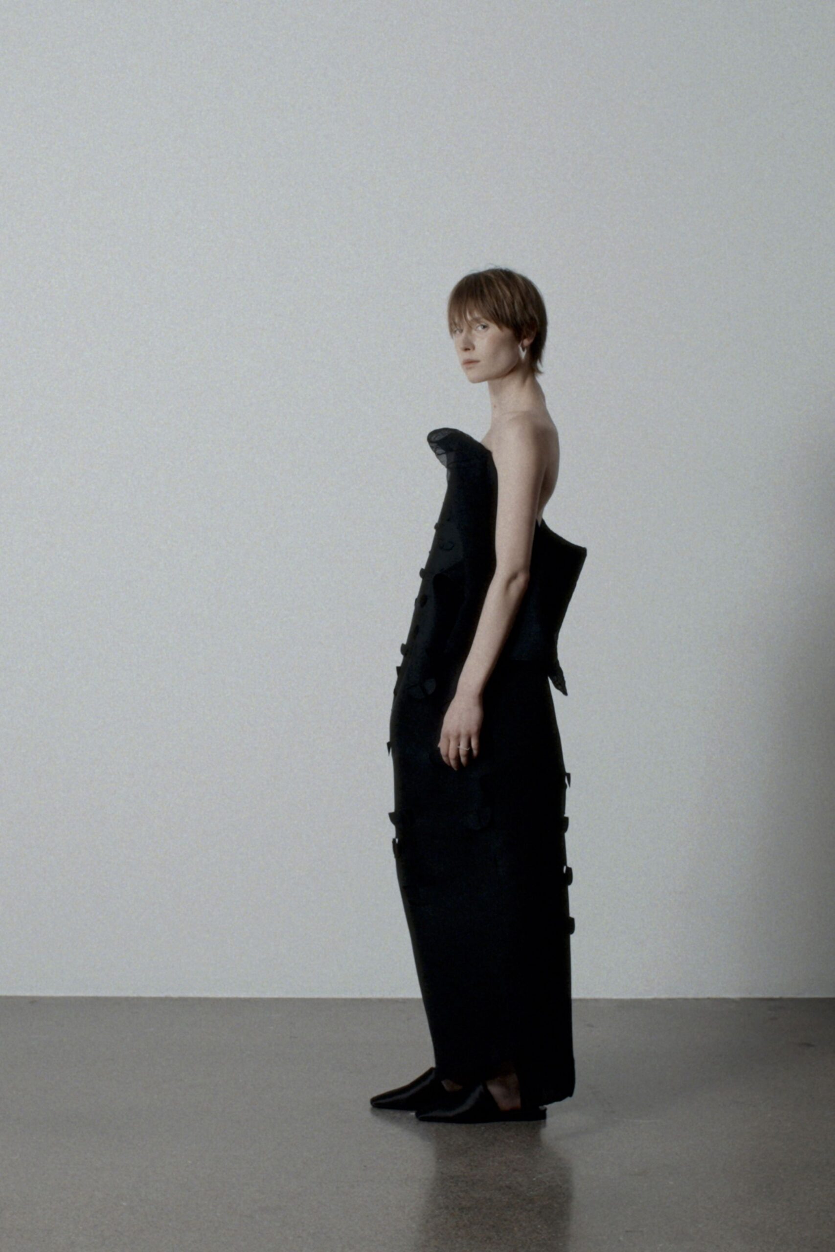 black cotton sleeveless high-neck fitted structured layered gown