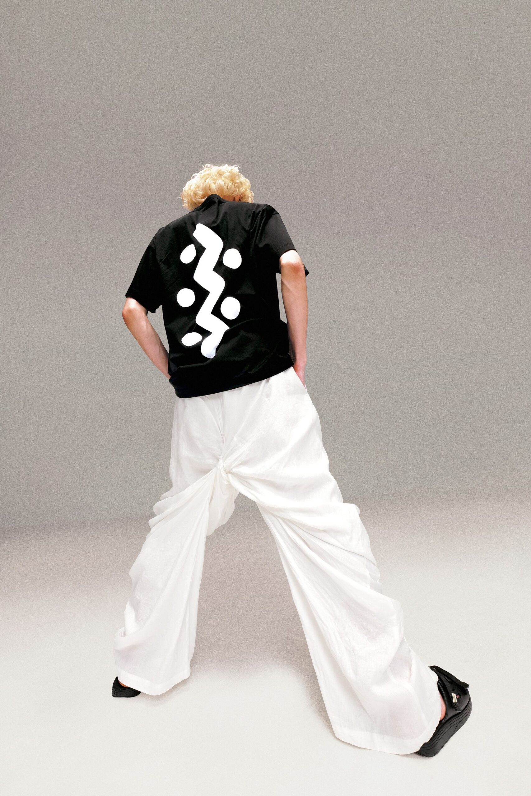 black t-shirt white wide-leg pants