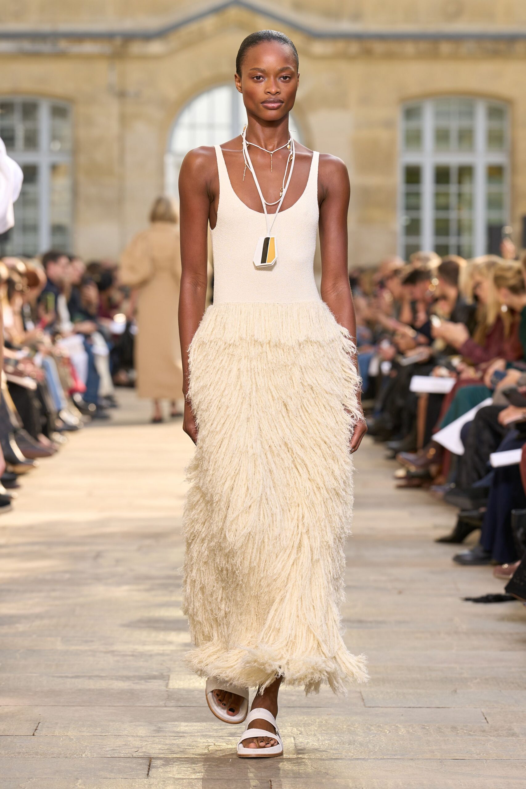 beige cotton sleeveless v-neck fitted fringed midi dress