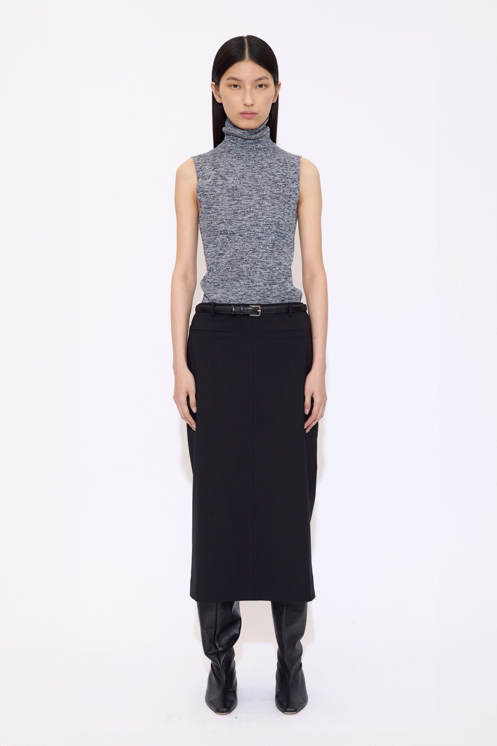 fitted gray turtleneck top and black midi skirt with boots