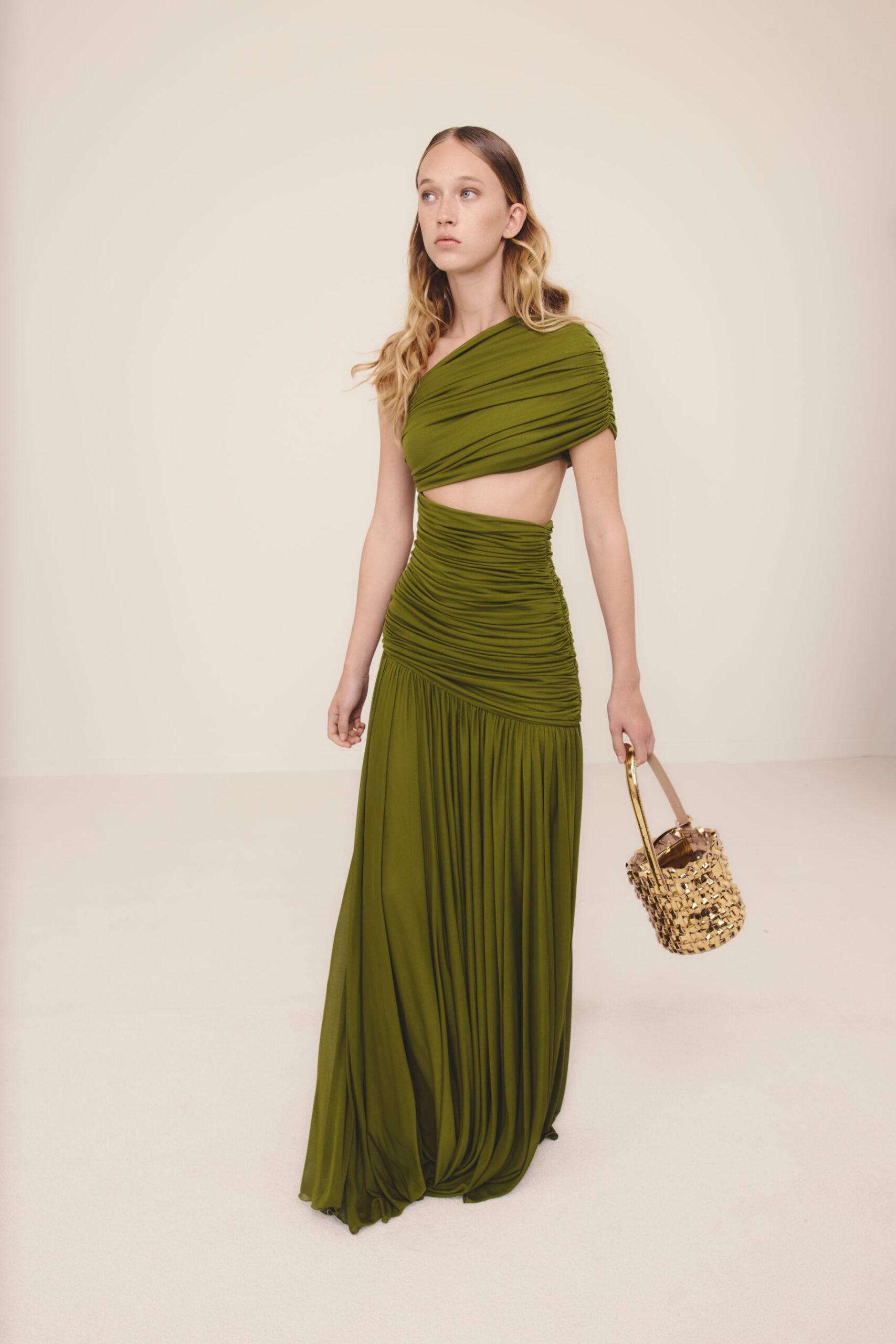 green silk sleeveless off-shoulder fitted ruched tiered gown