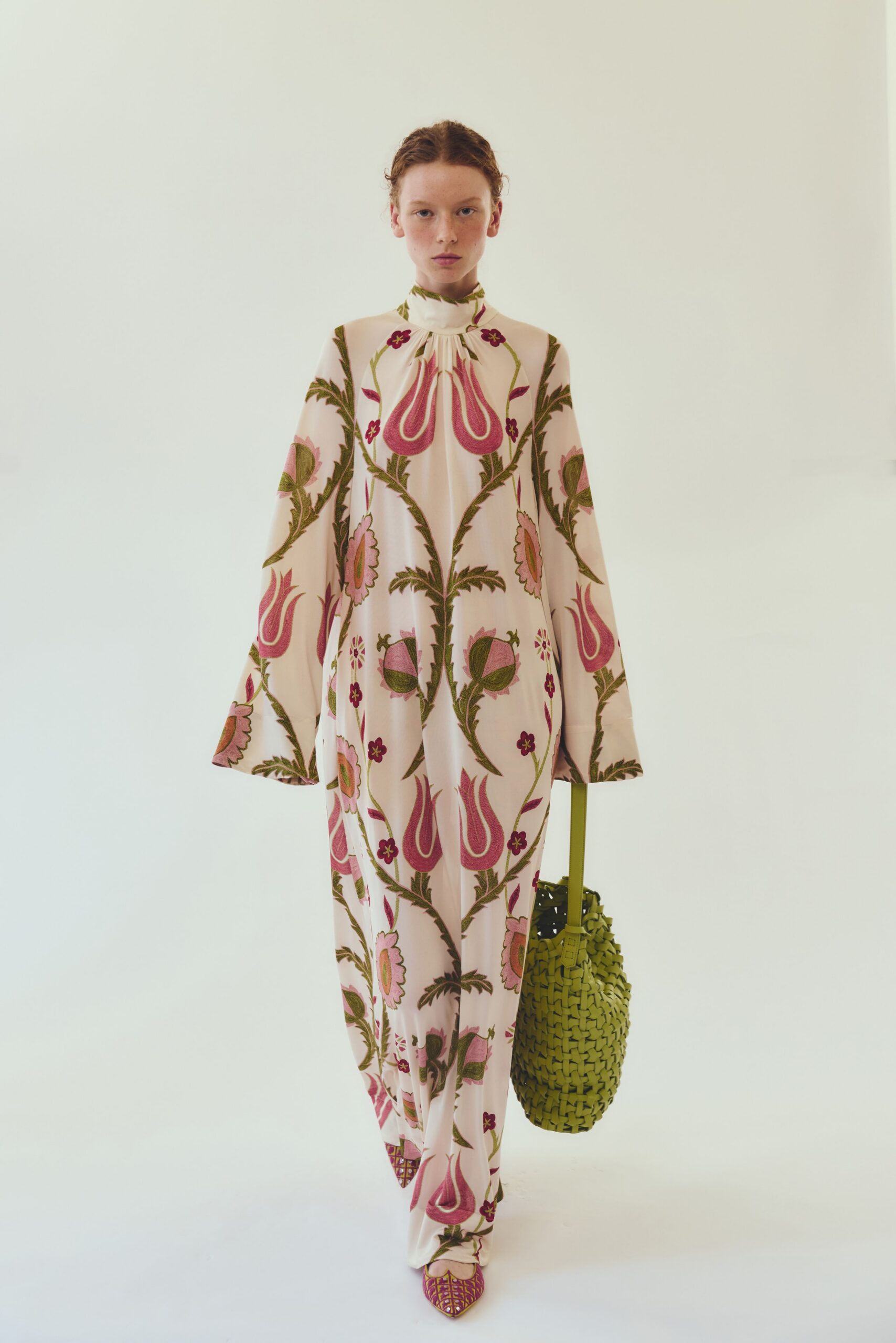 floral printed maxi dress with green bag