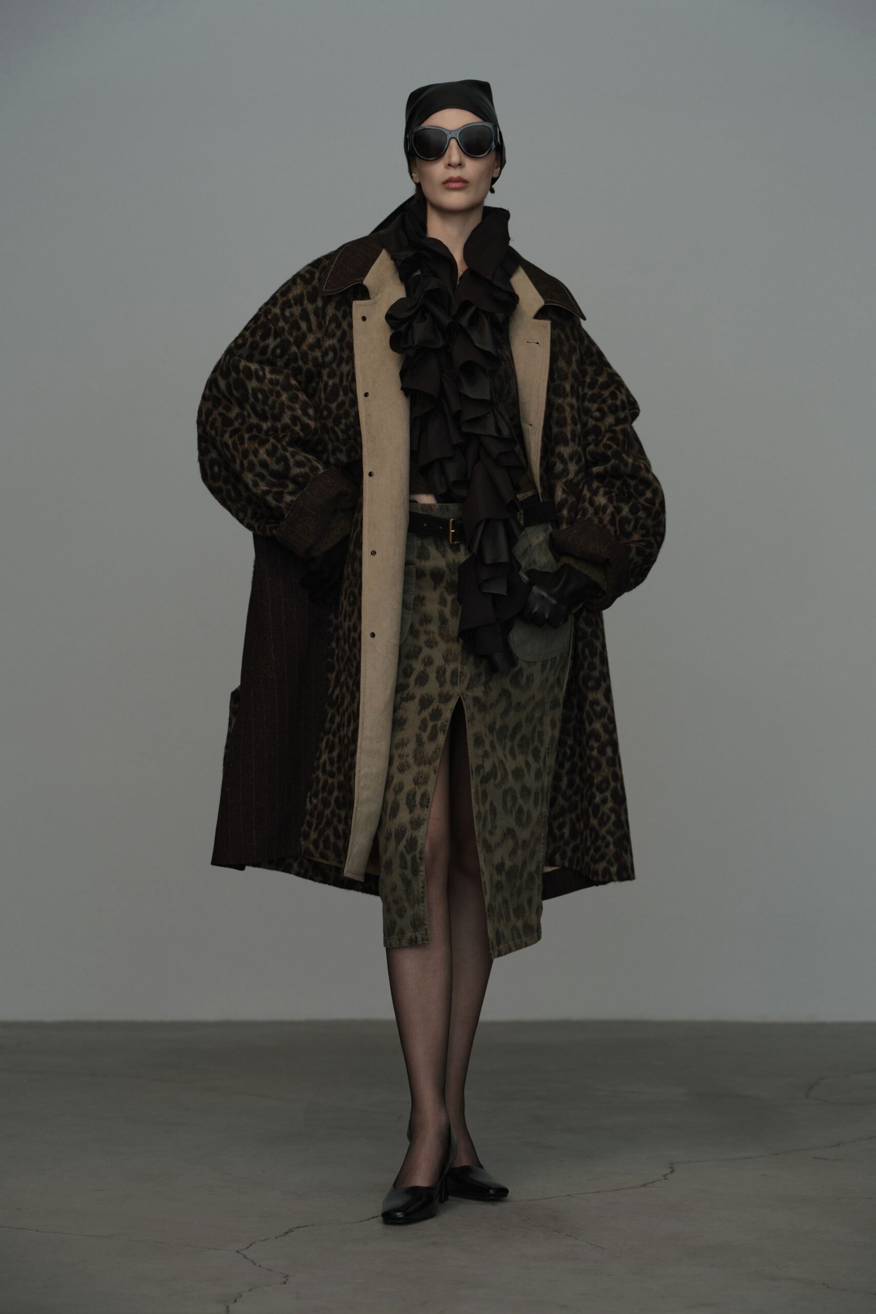 oversized animal-print coat with ruffled blouse