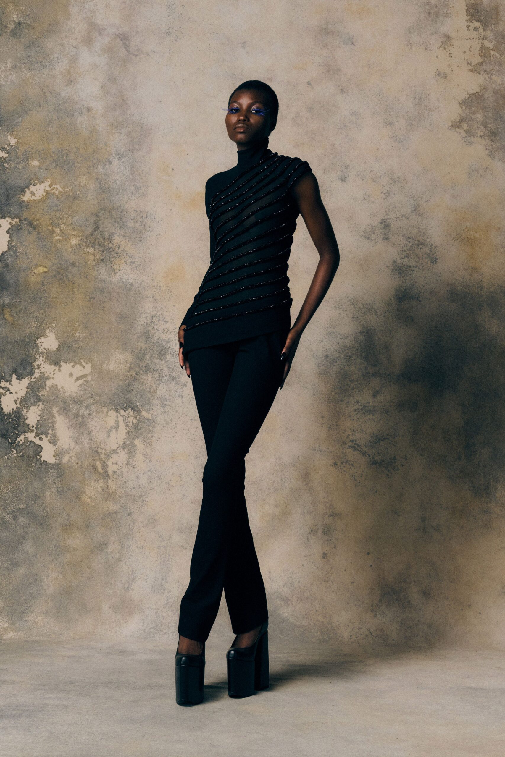 black fitted top and pants with heels