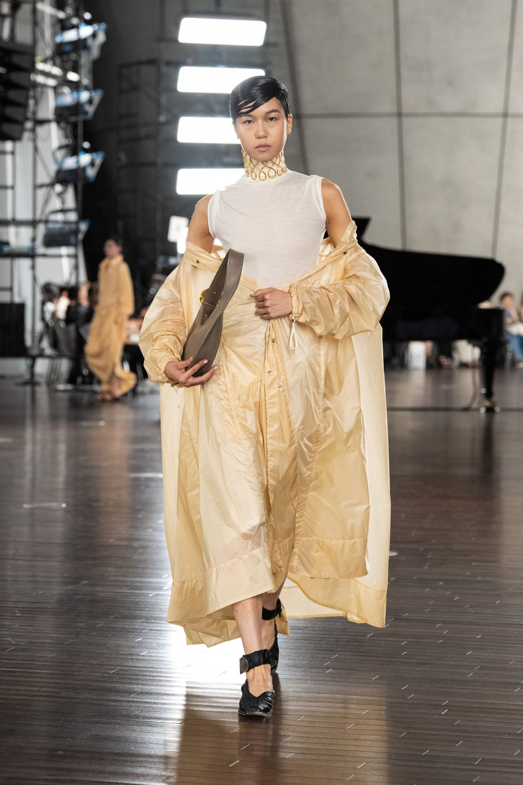 white fitted top with beige coat