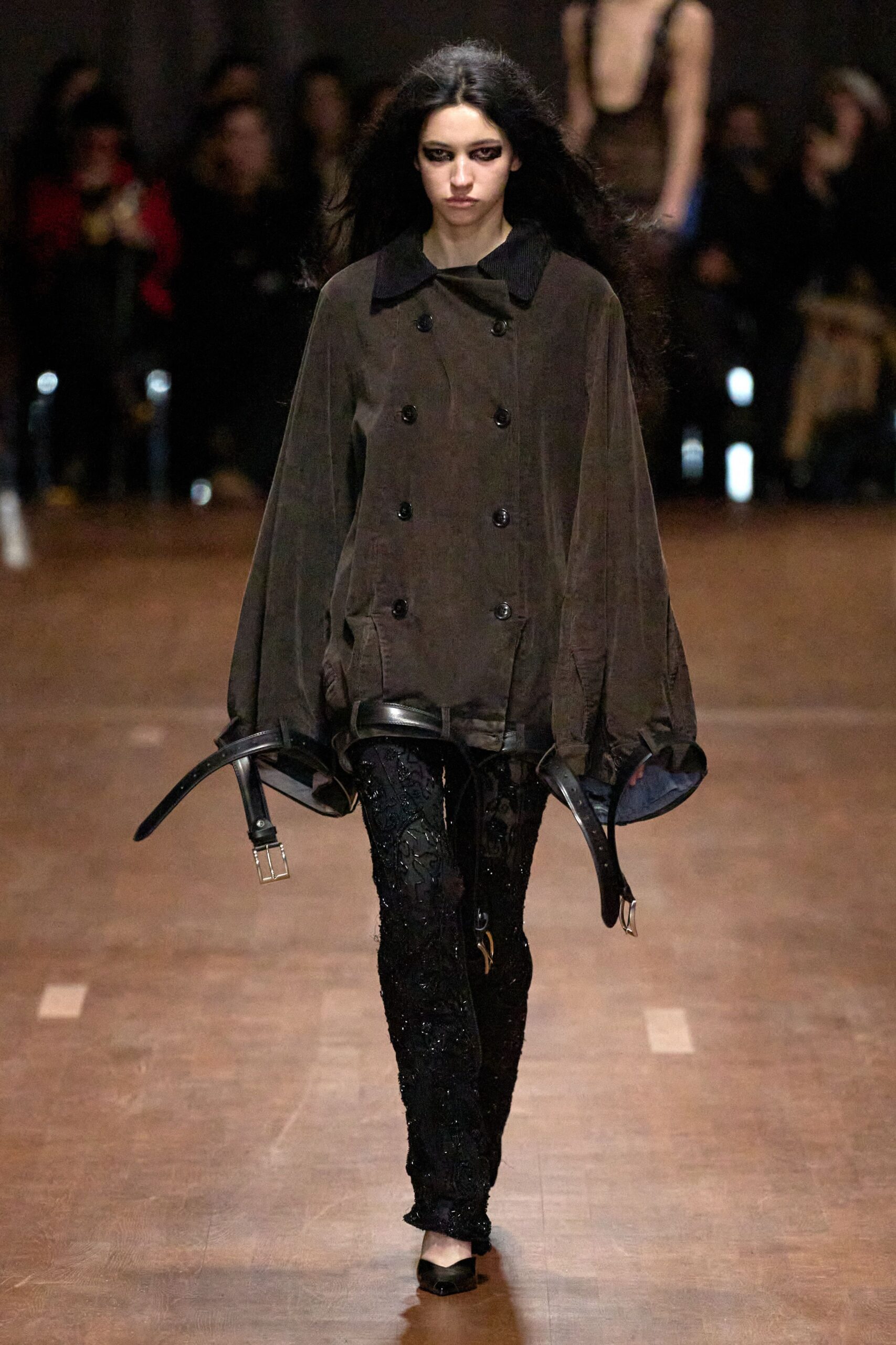 brown relaxed coat with black pants