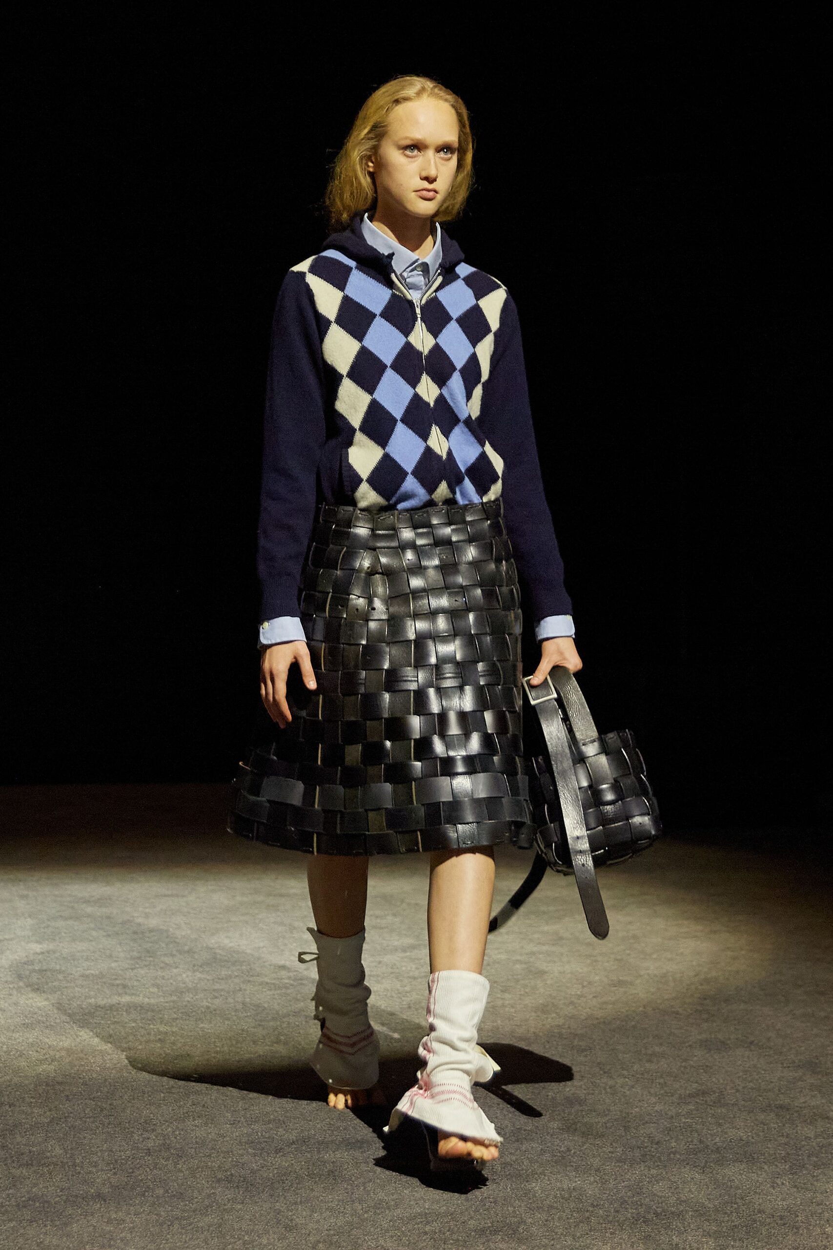 blue and white checked sweater with black leather skirt