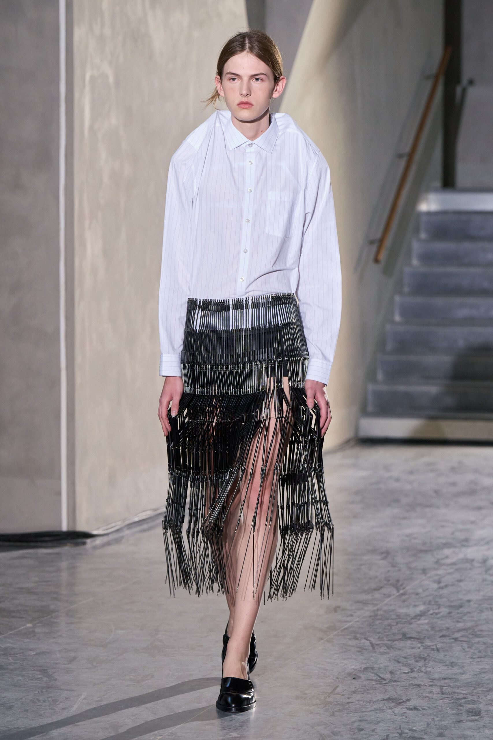 white striped shirt black fringed skirt