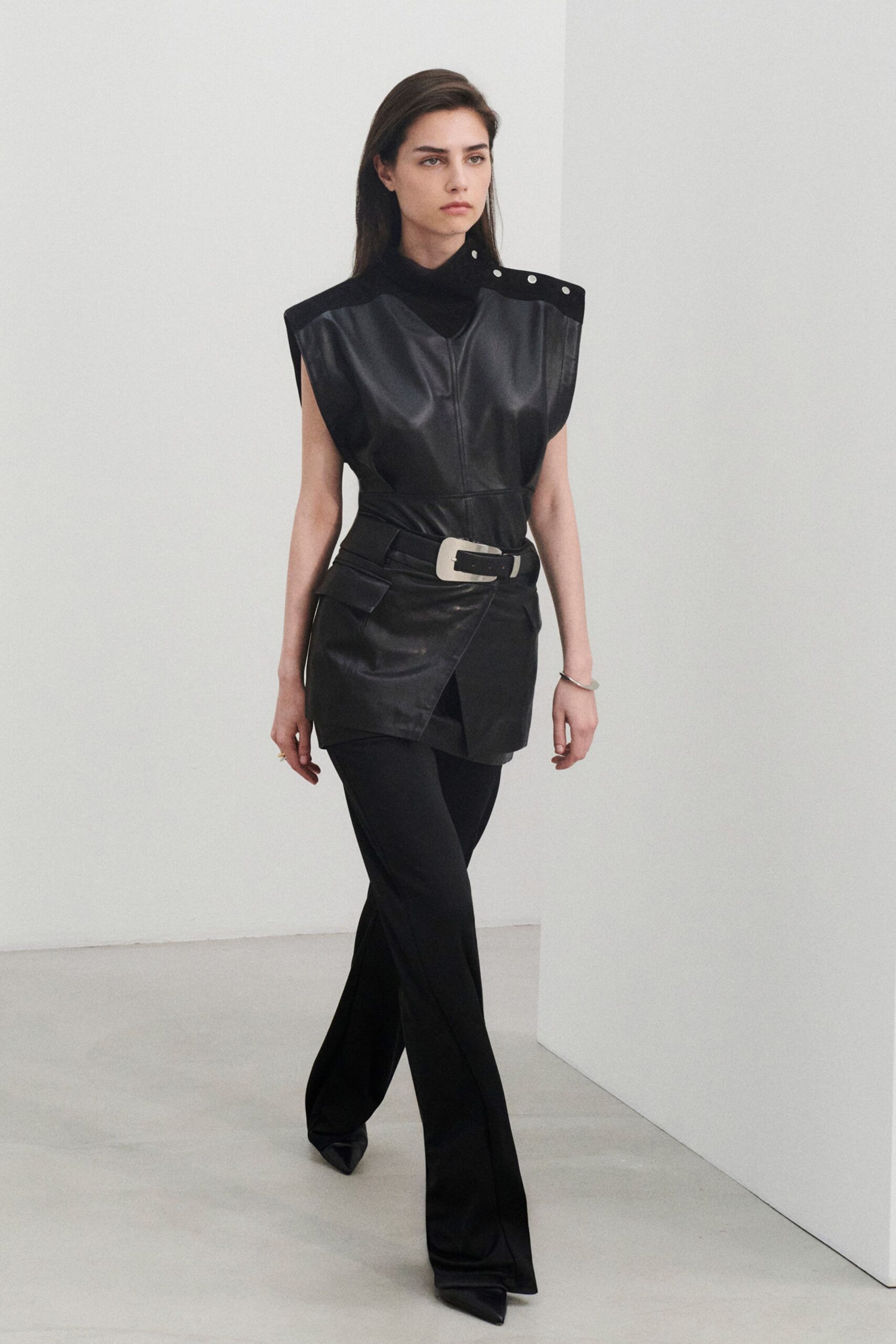 black leather sleeveless high-neck fitted structured top