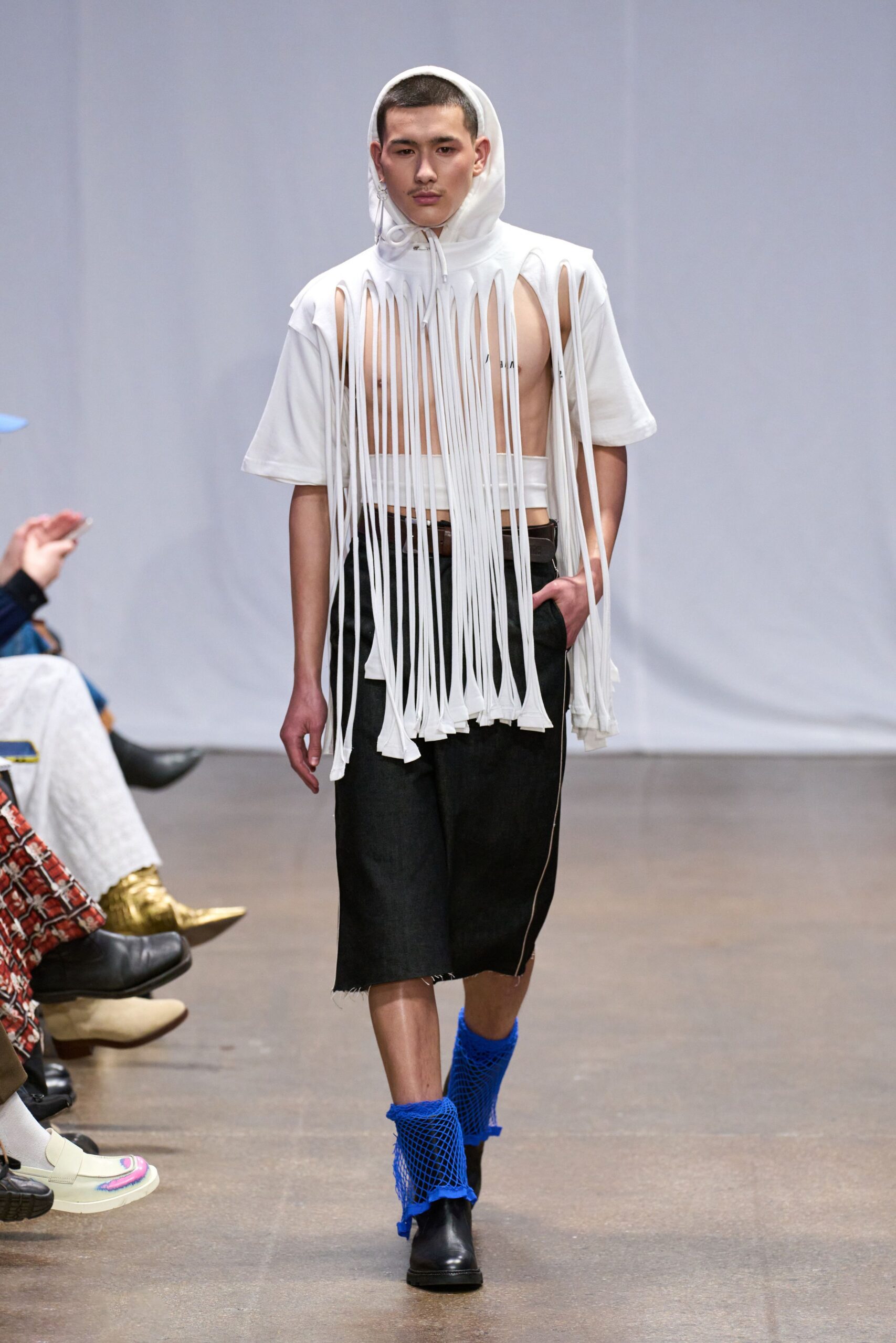 white fringed top with black skirt