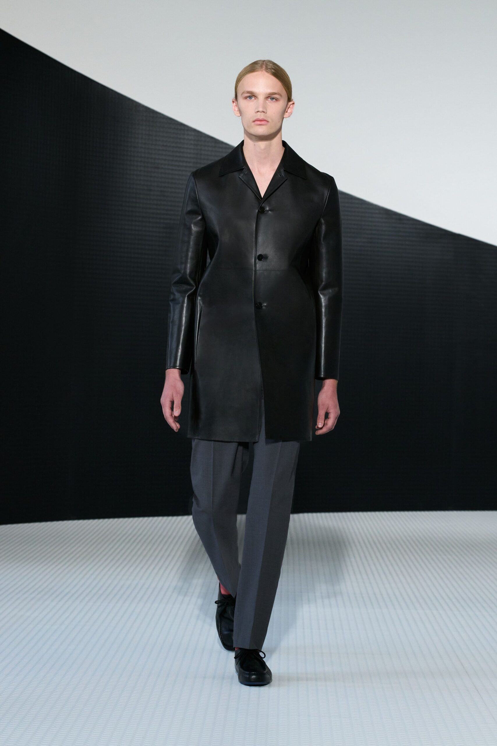 black leather coat with gray pants