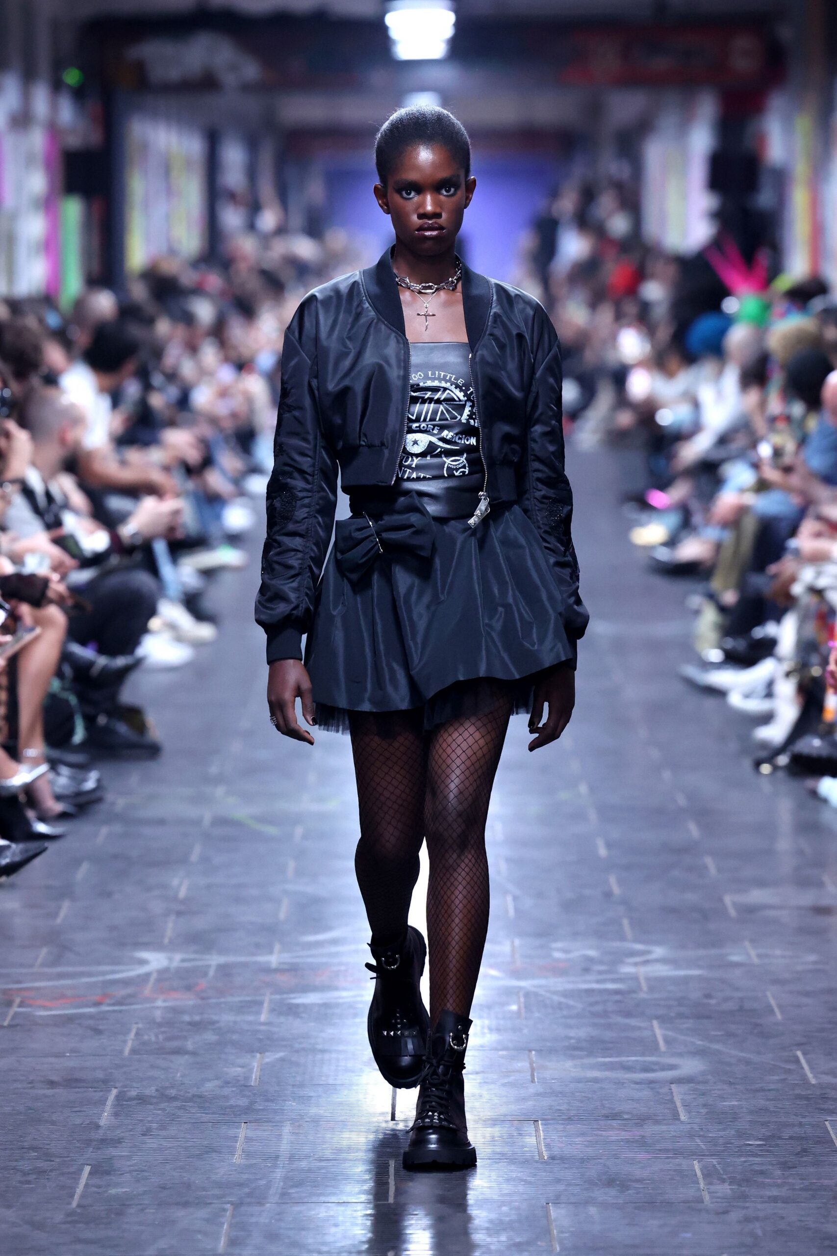 black fitted jacket and mini skirt