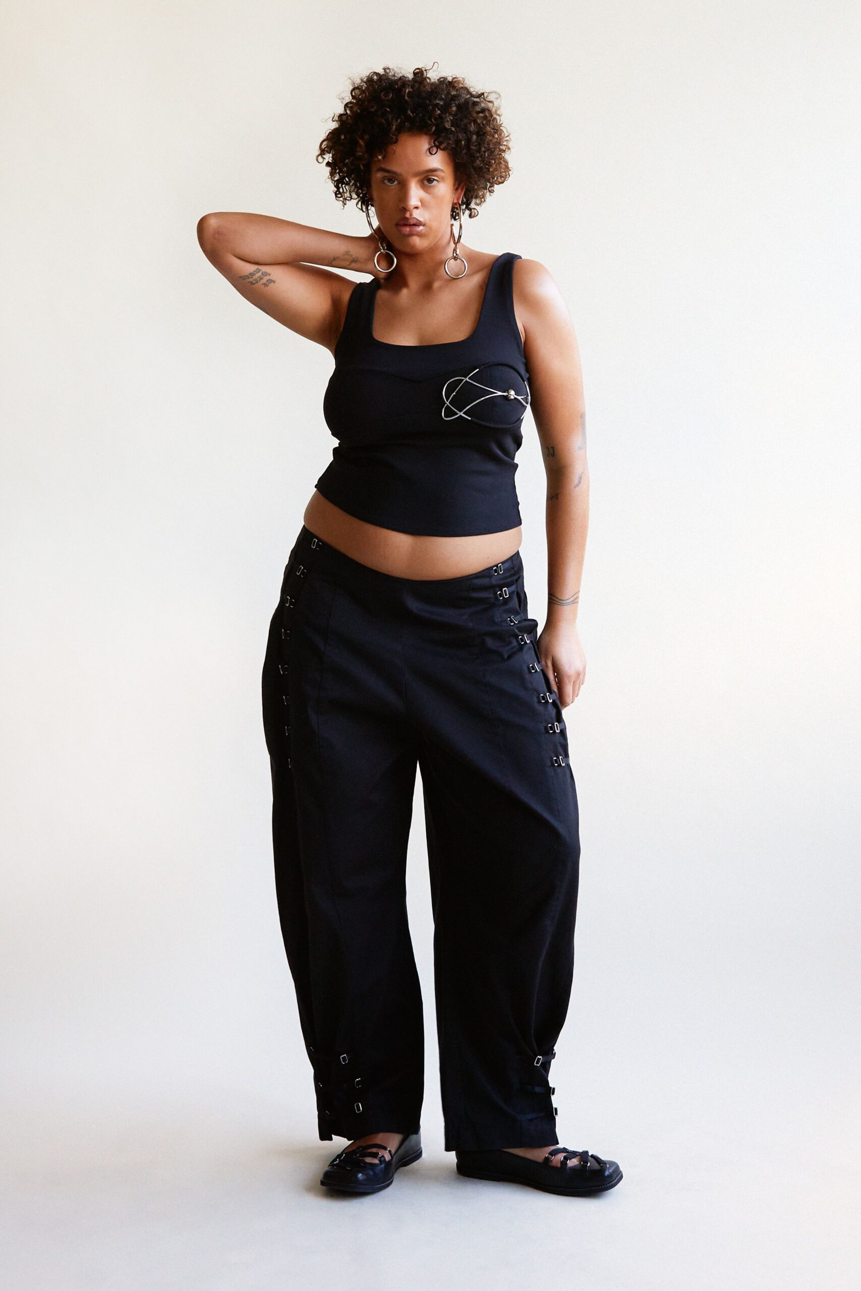 black tank-top and relaxed pants