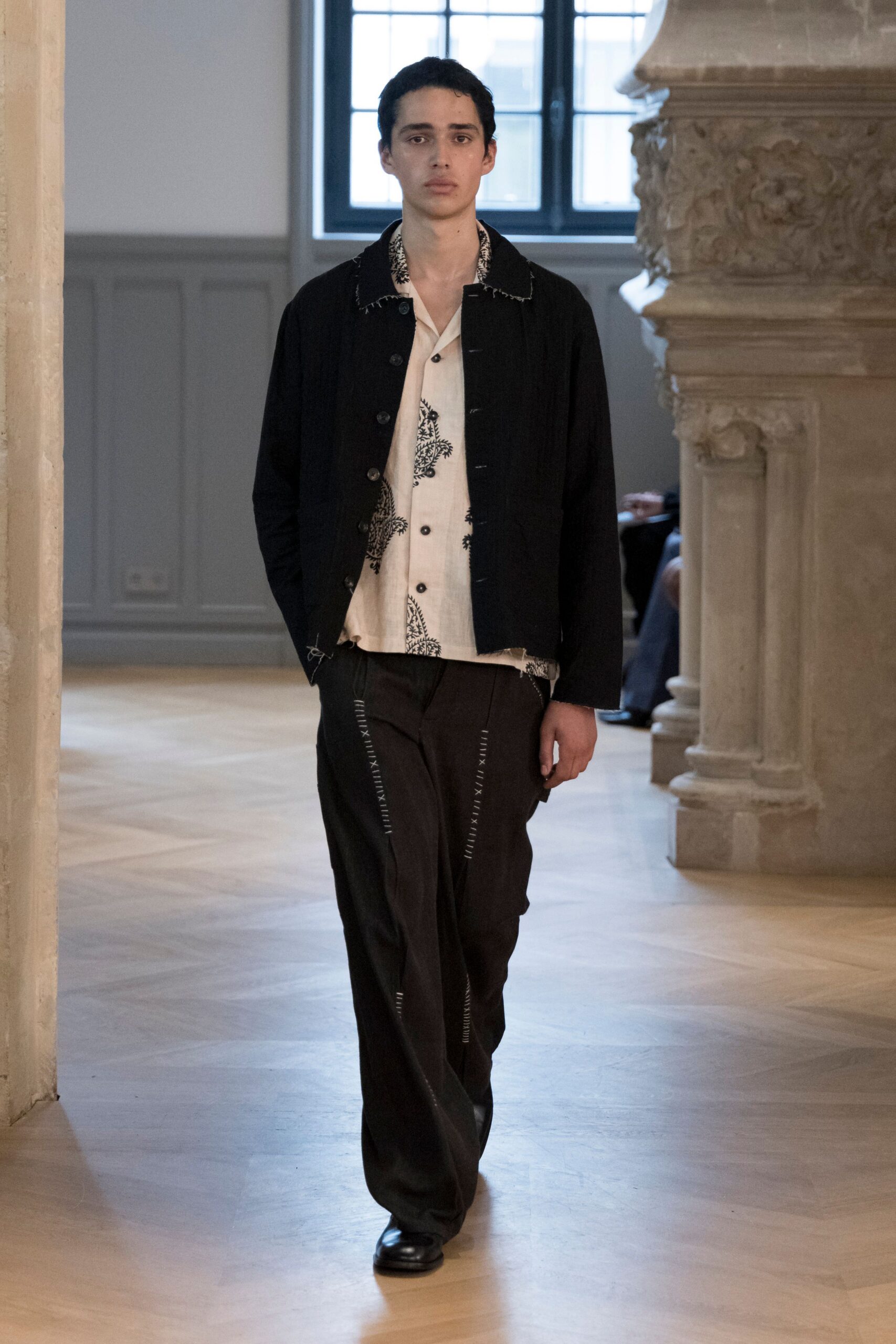 black jacket white shirt black pants