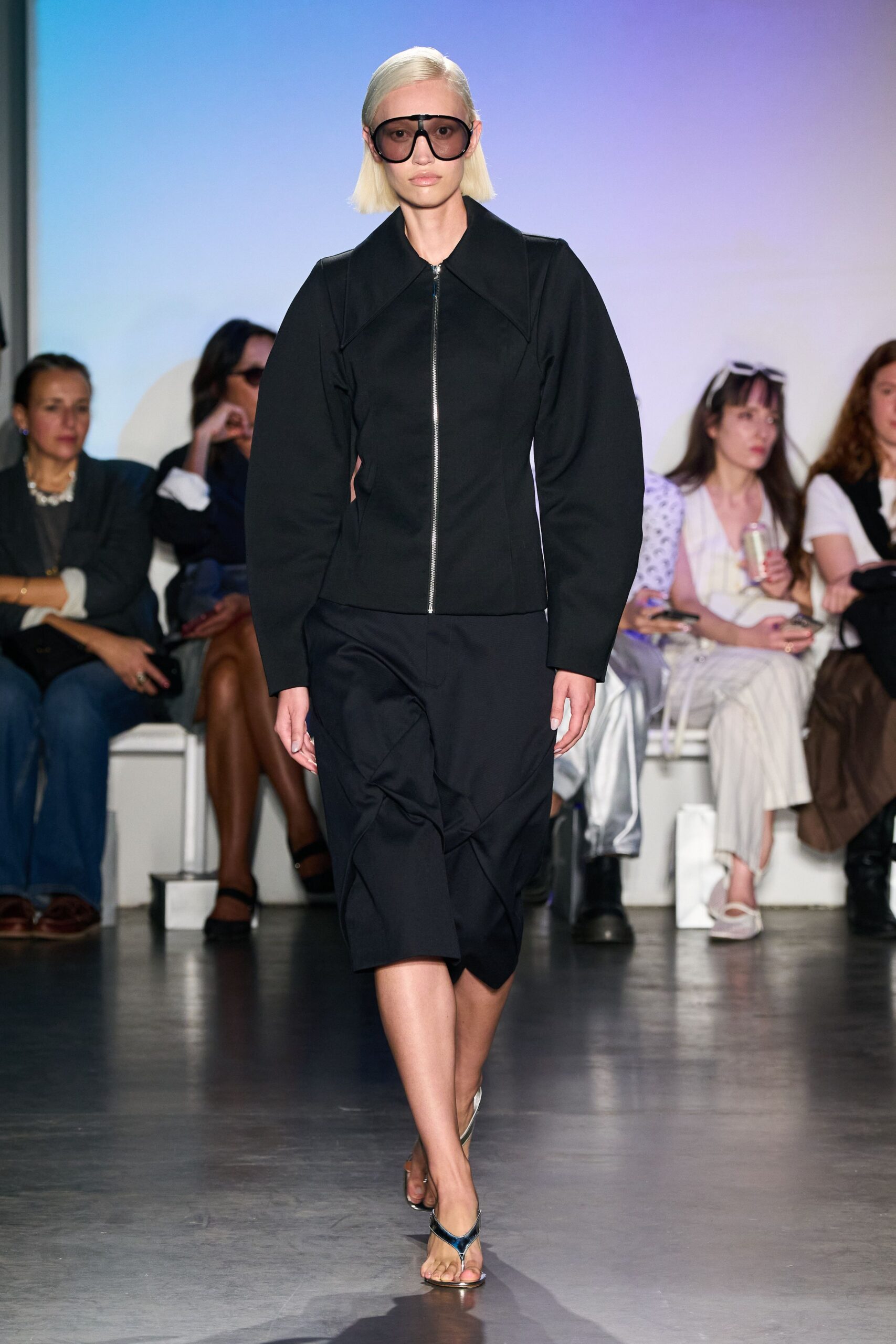 black structured jacket with asymmetric skirt