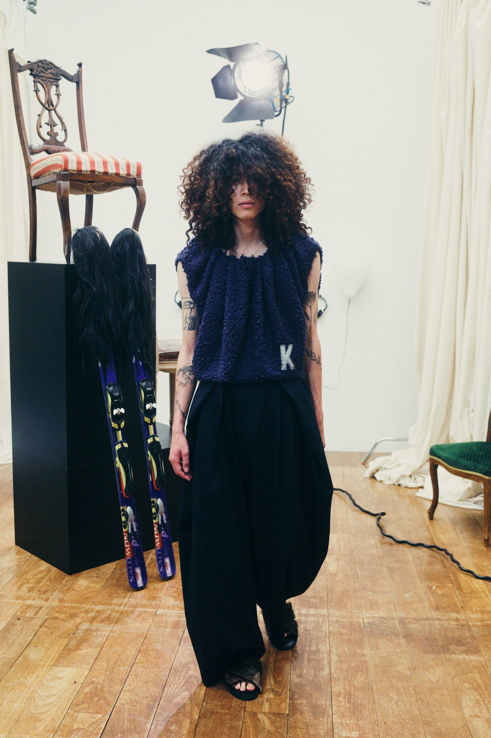 purple relaxed top with black pants