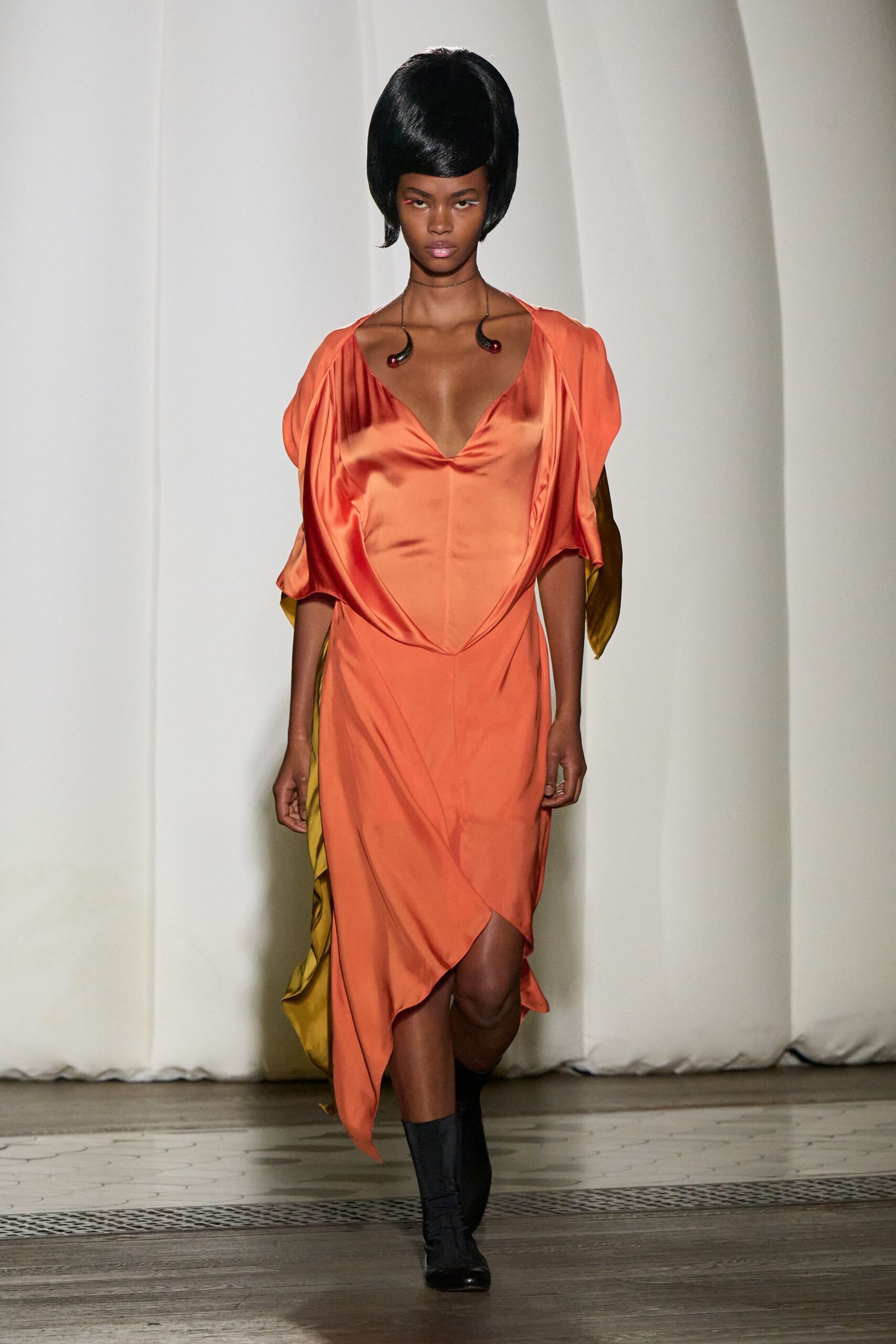 orange silk midi dress with black boots