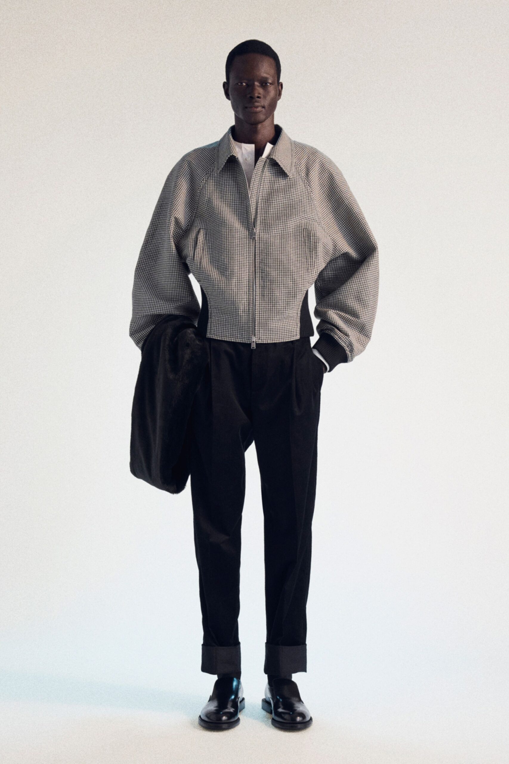 black and white fitted jacket with relaxed pants