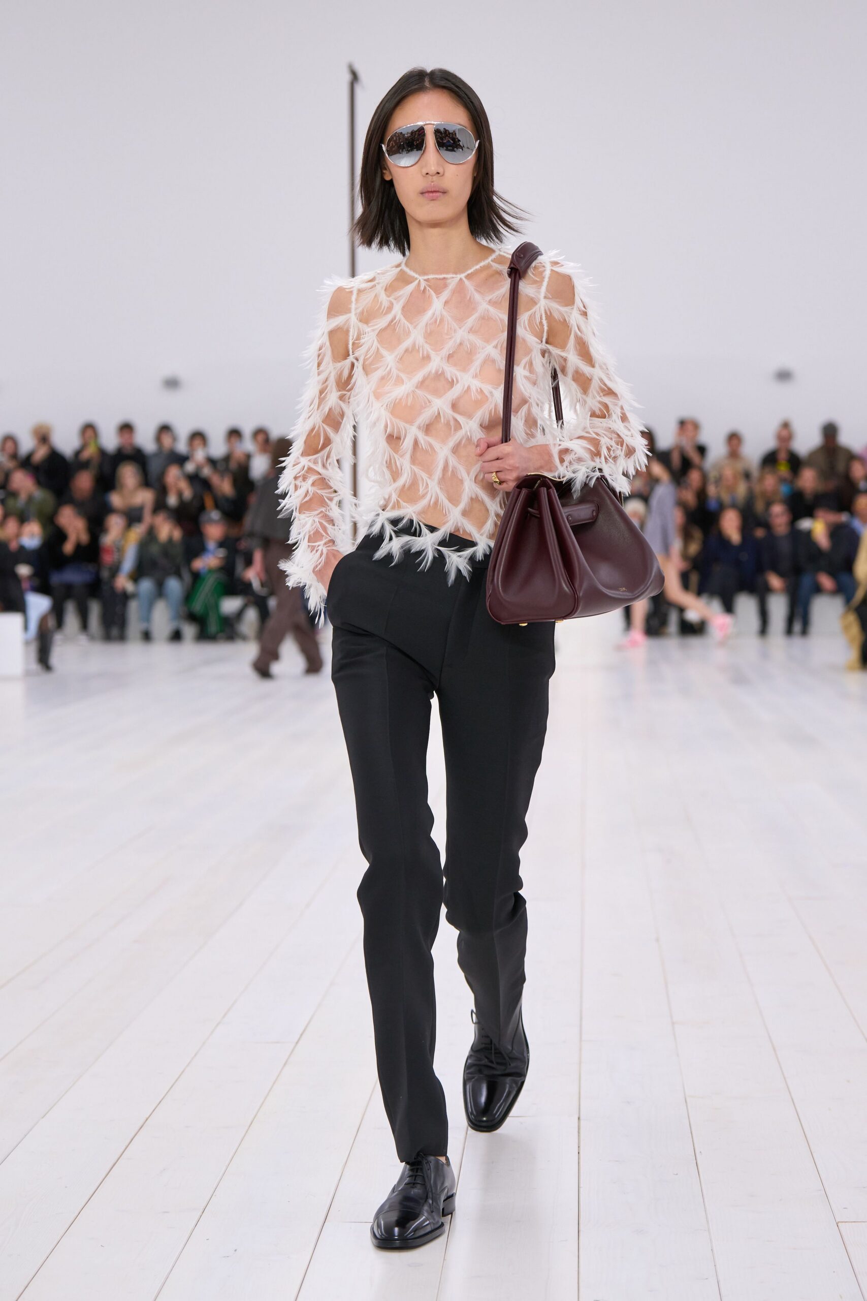 white fringed top with black pants