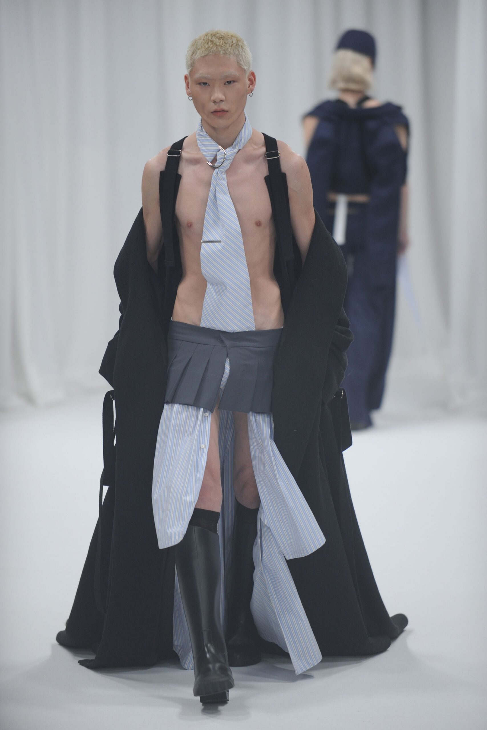 black wool coat with pleated skirt
