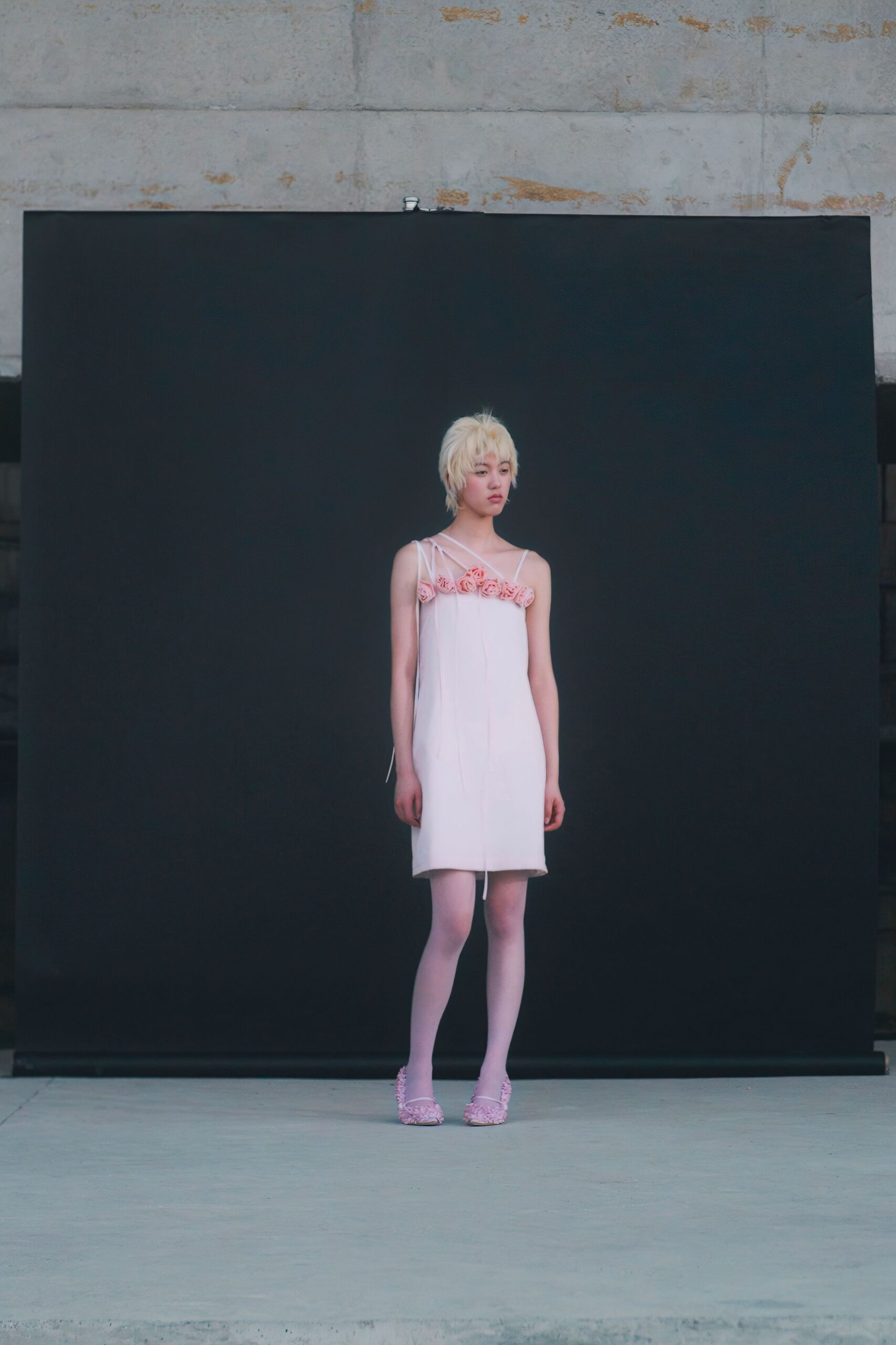 pink cotton sleeveless v-neck fitted ruffled mini dress