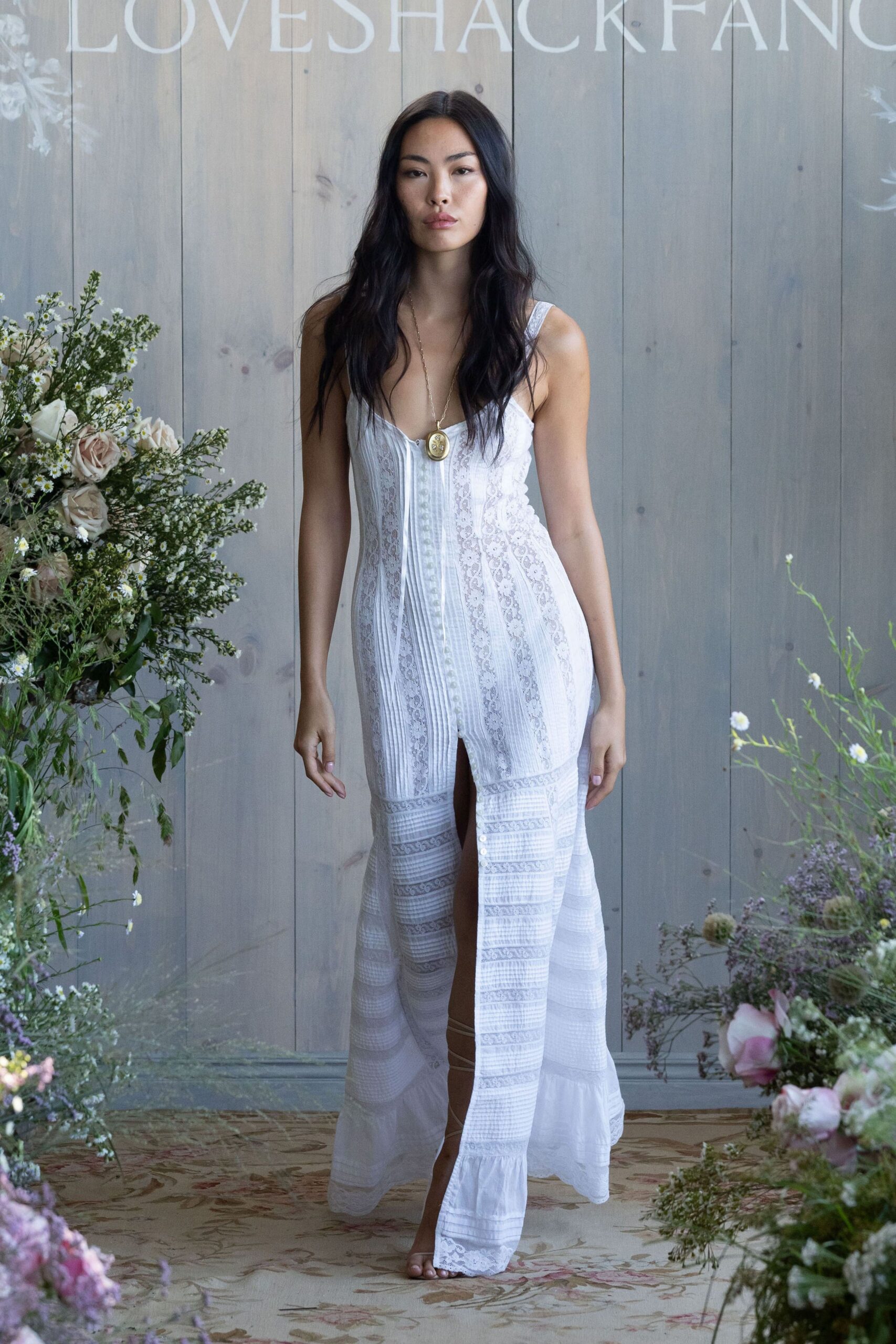 white cotton sleeveless v-neck fitted embroidered tiered gown