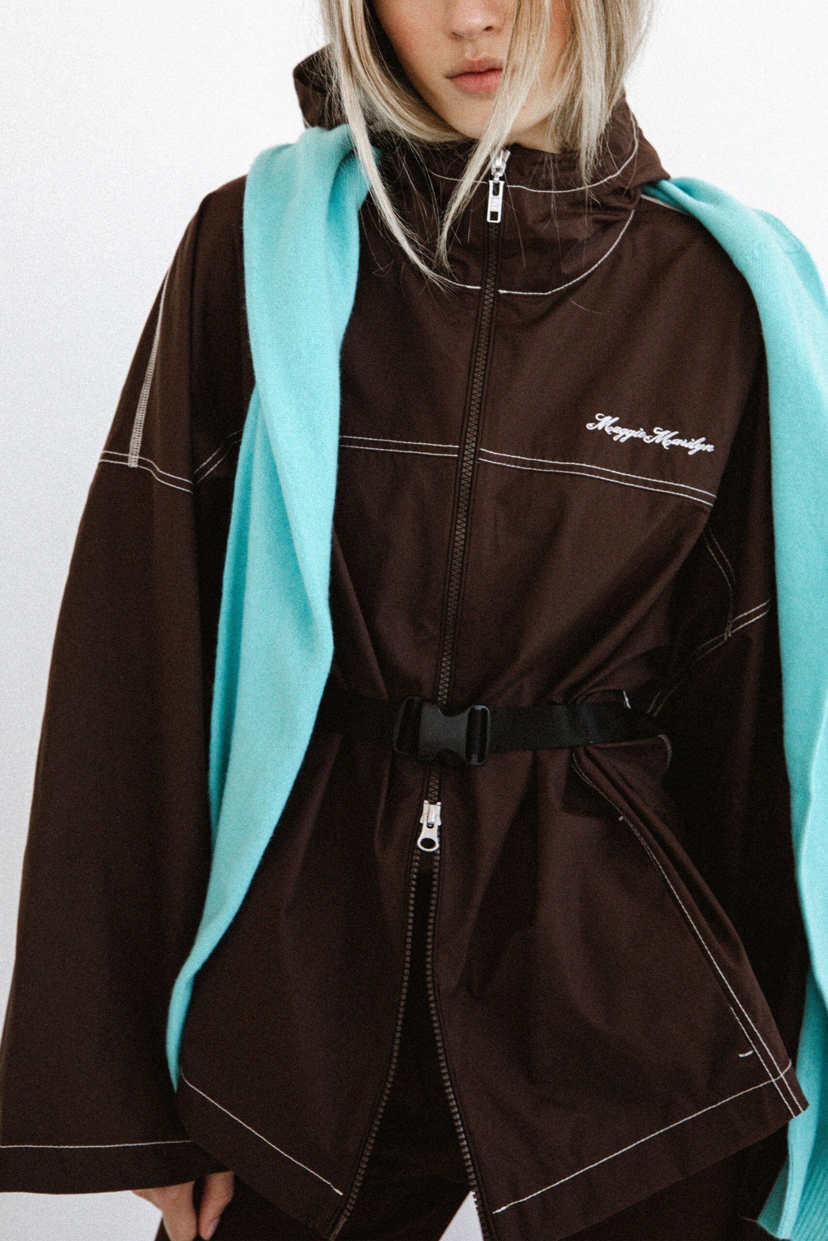 brown jacket blue sweater outfit