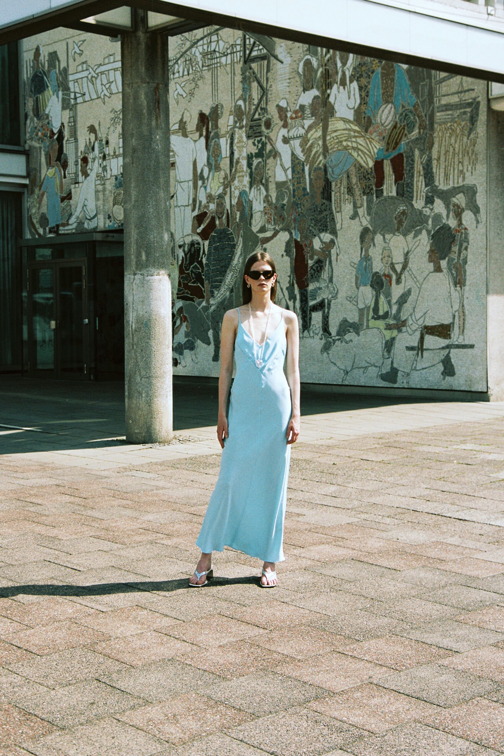blue silk sleeveless v-neck fitted draped flowing dress