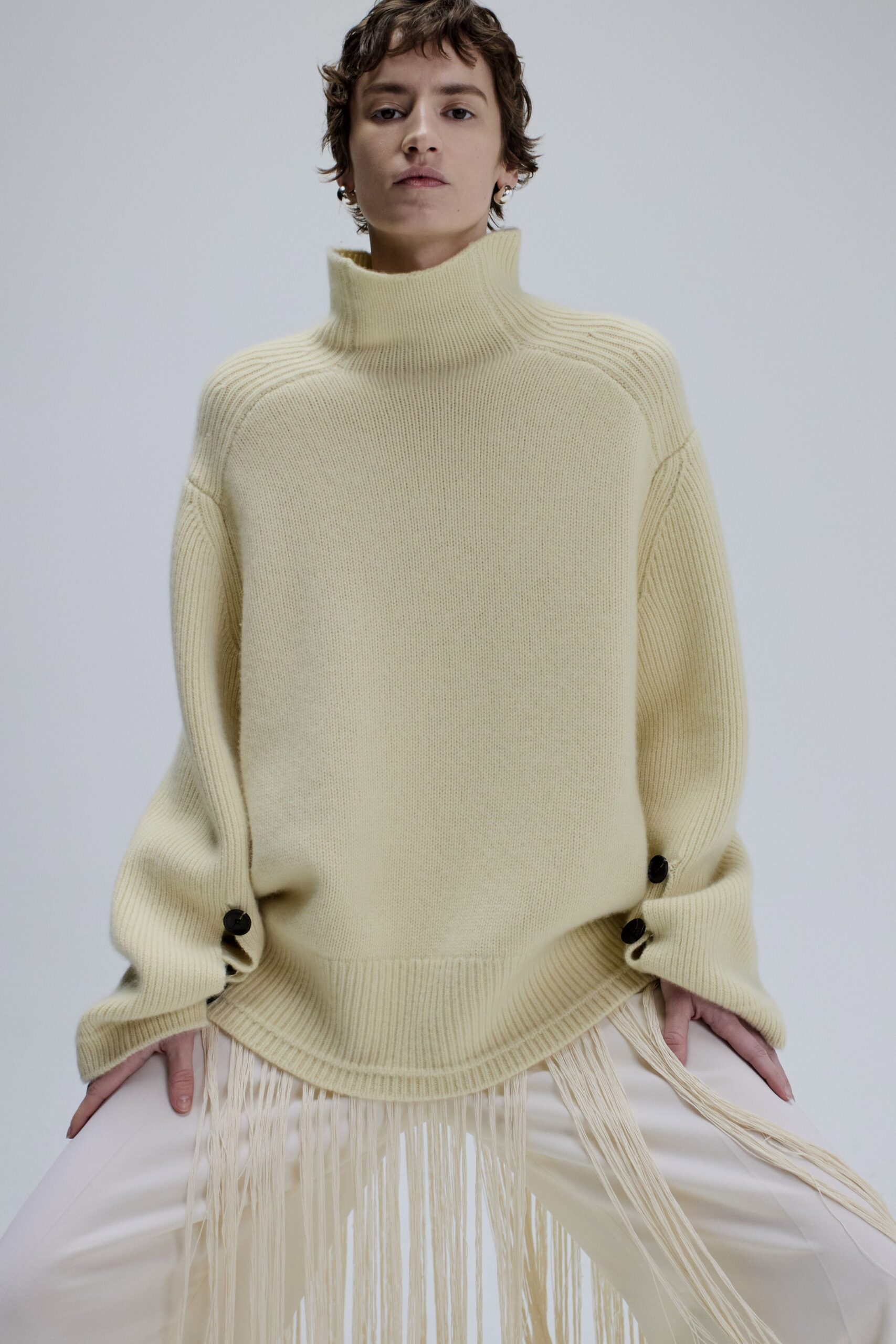 yellow oversized sweater with fringes