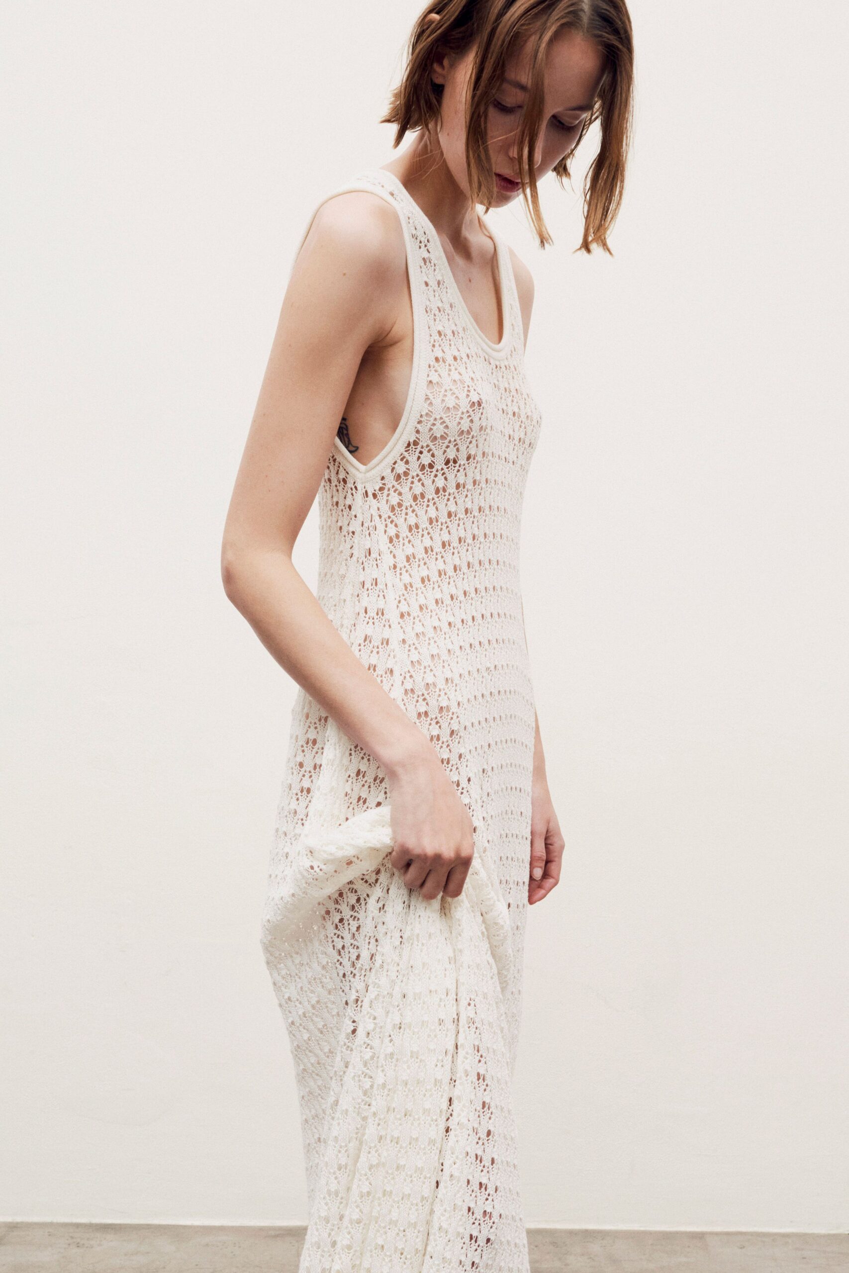 white embroidered sleeveless dress