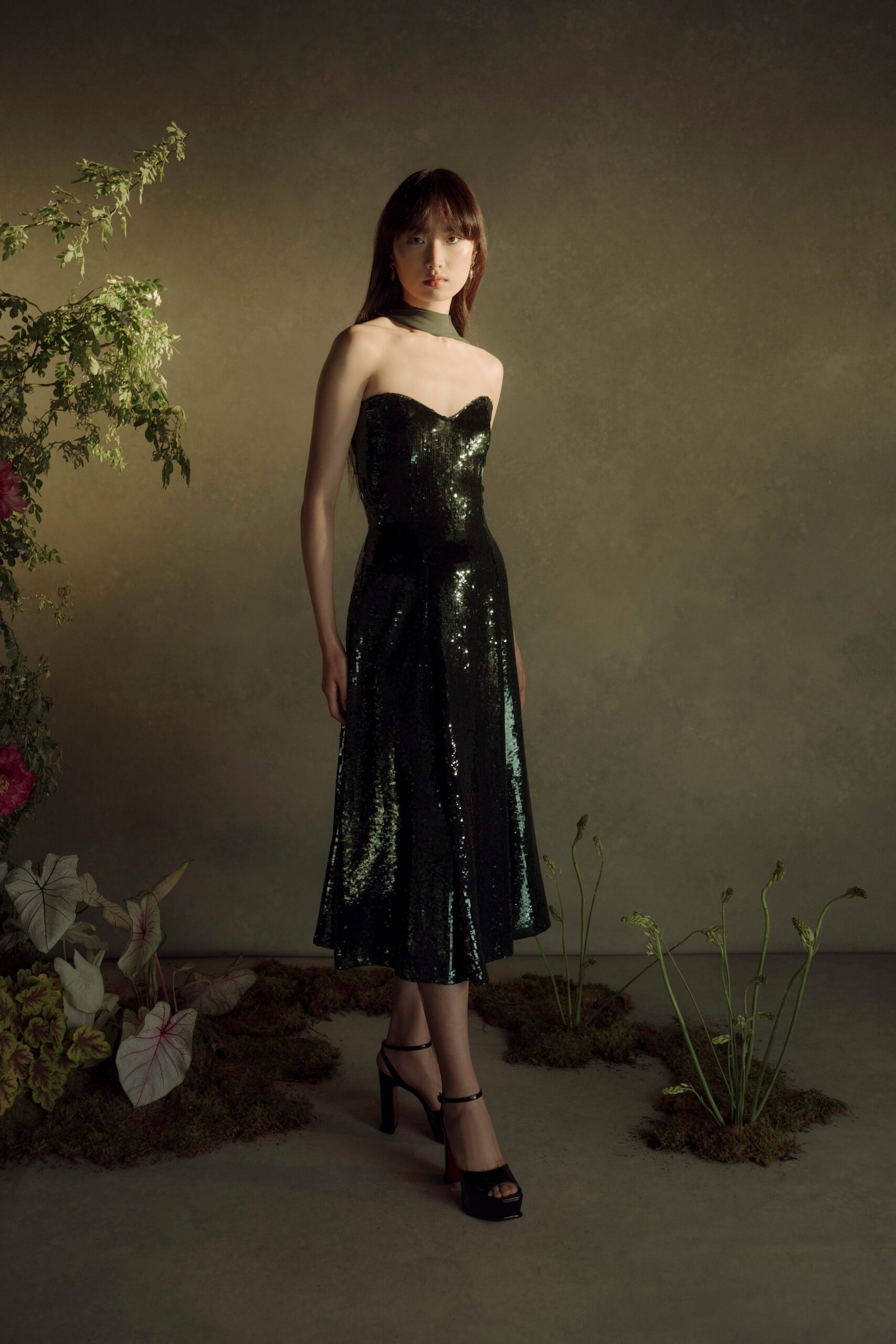 black sequin strapless fitted flared shiny midi dress