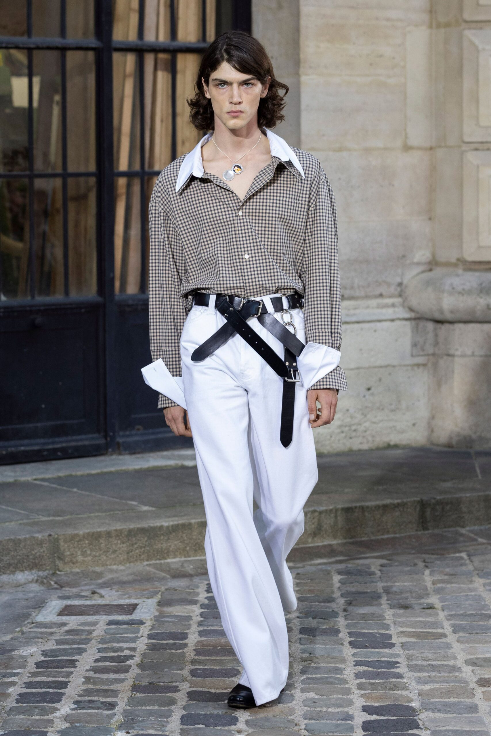 checked shirt and white pants