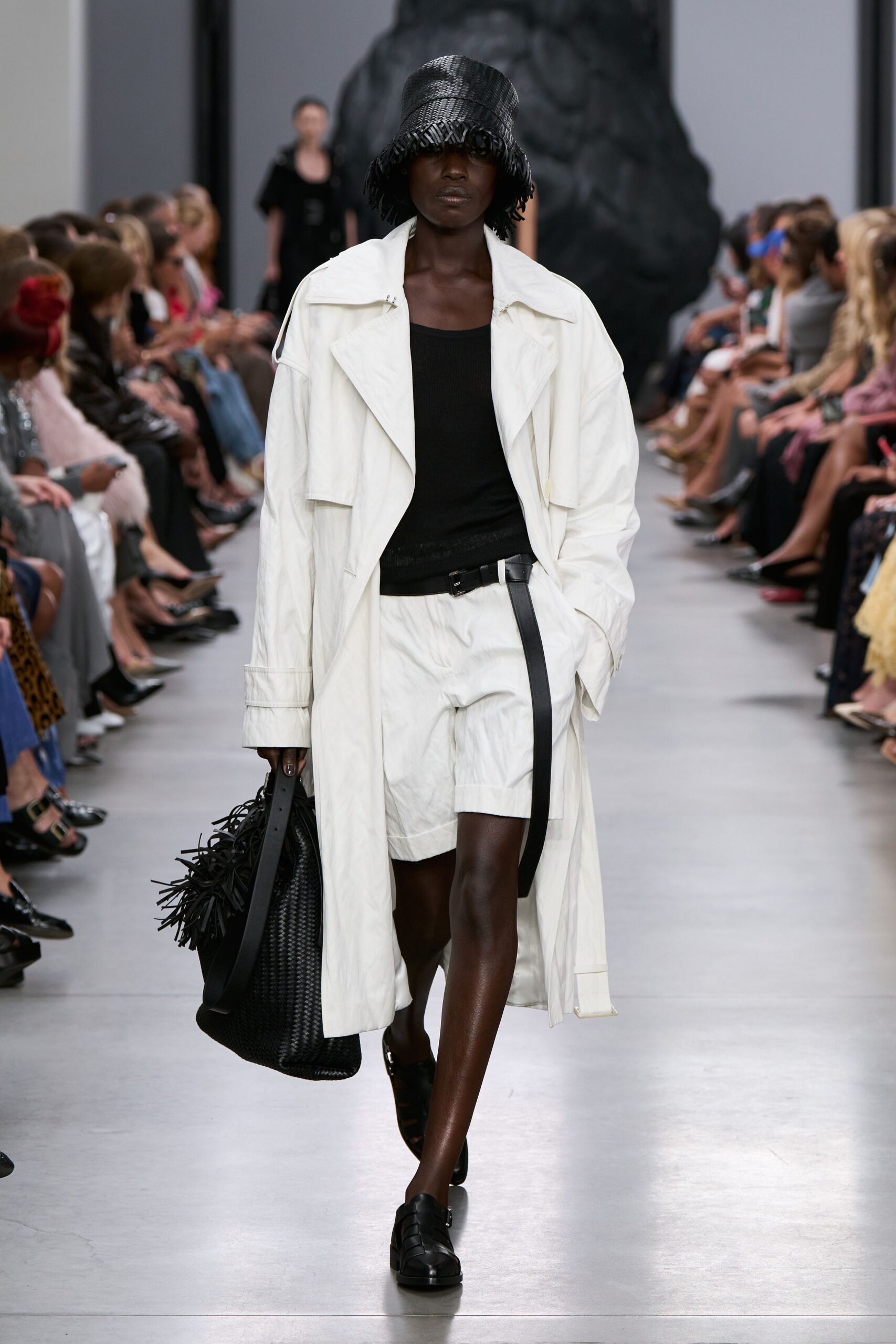 white coat black top shorts