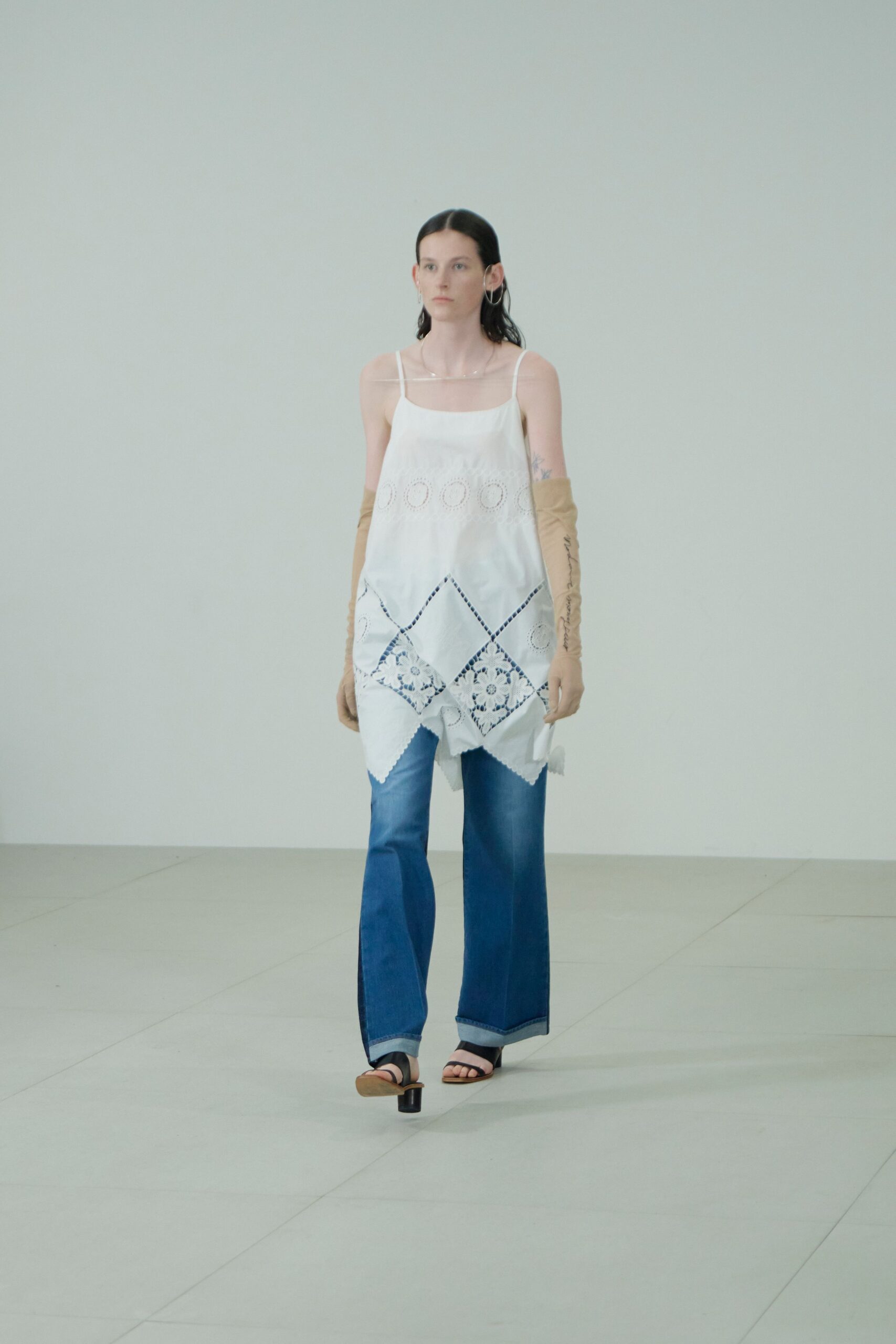 white embroidered top with blue pants