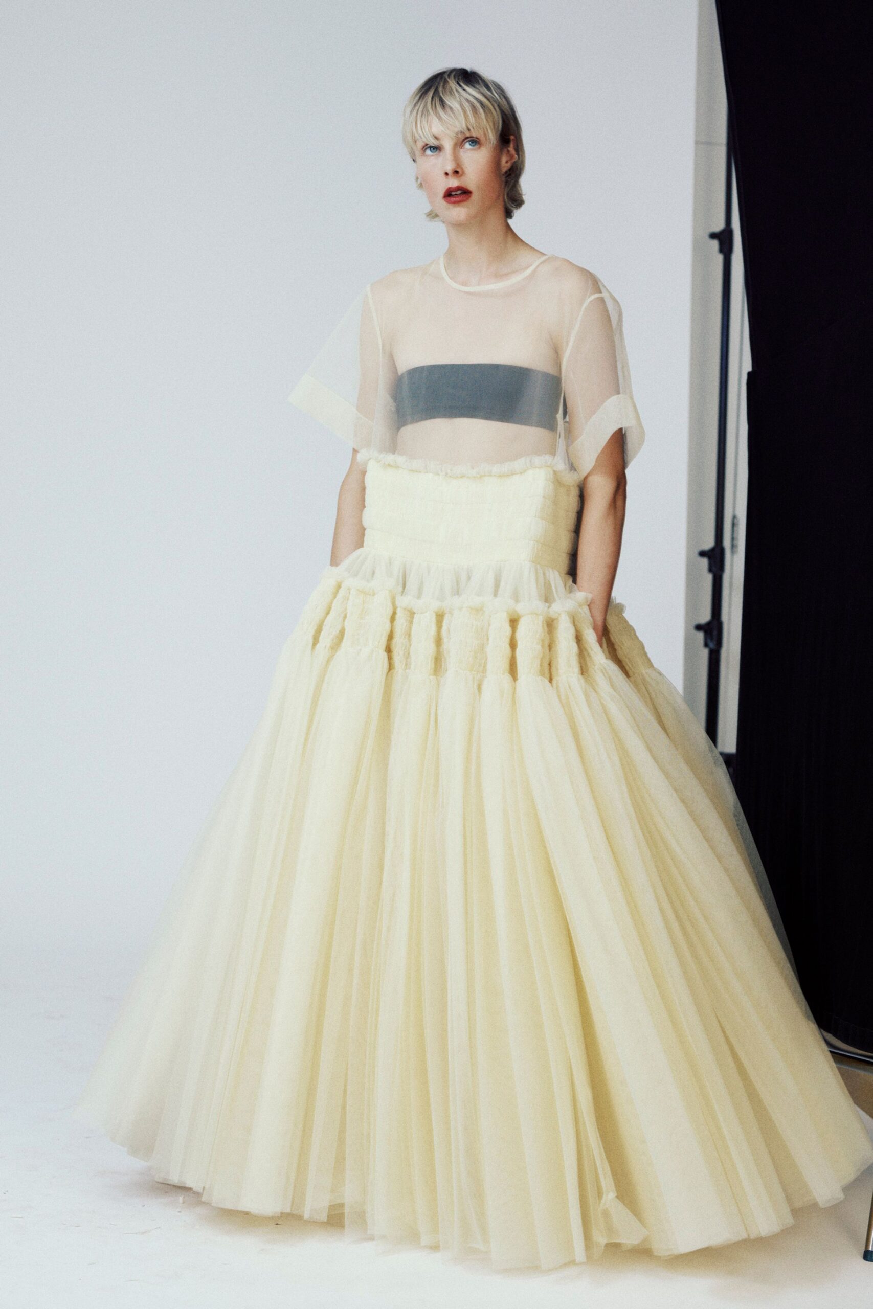 sheer top and tiered yellow skirt