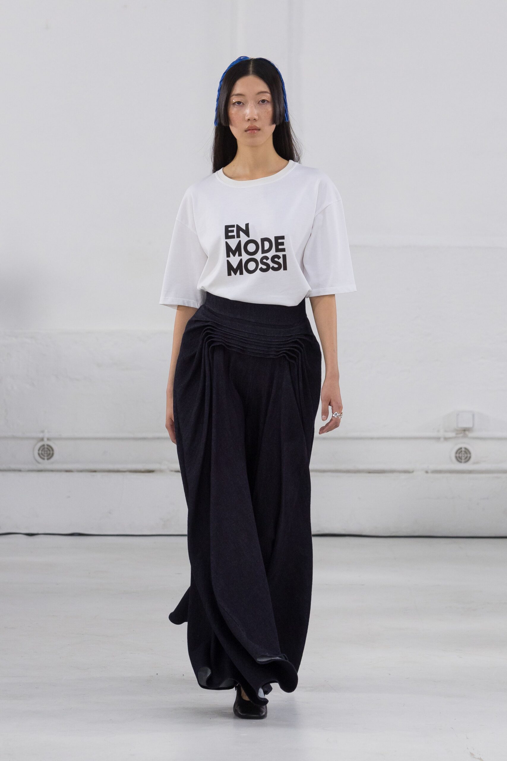 white relaxed t-shirt with black skirt