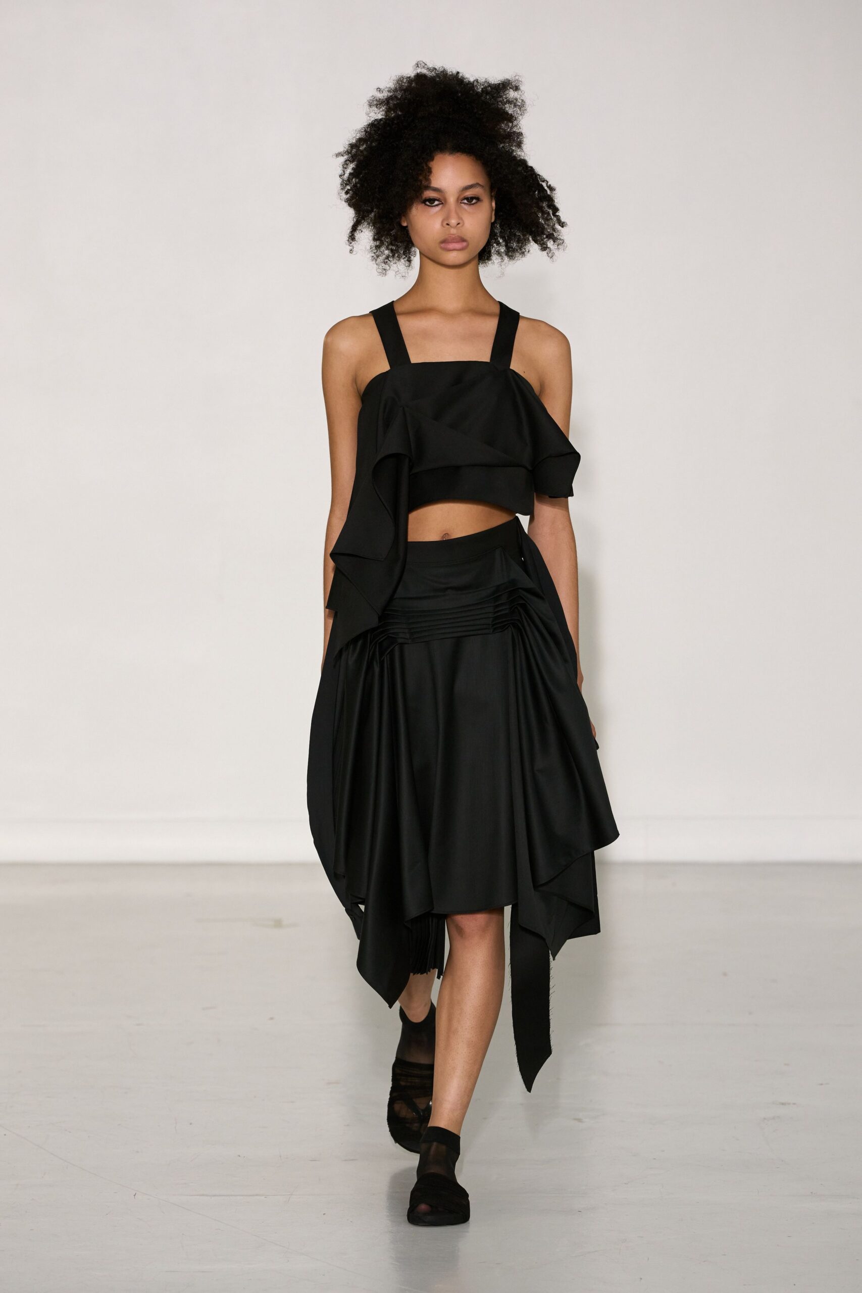 black ruffled top and skirt