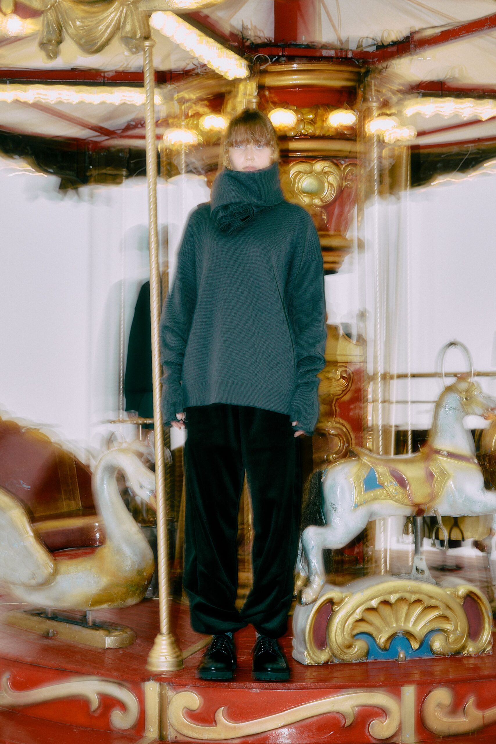 gray relaxed turtleneck sweater with black pants