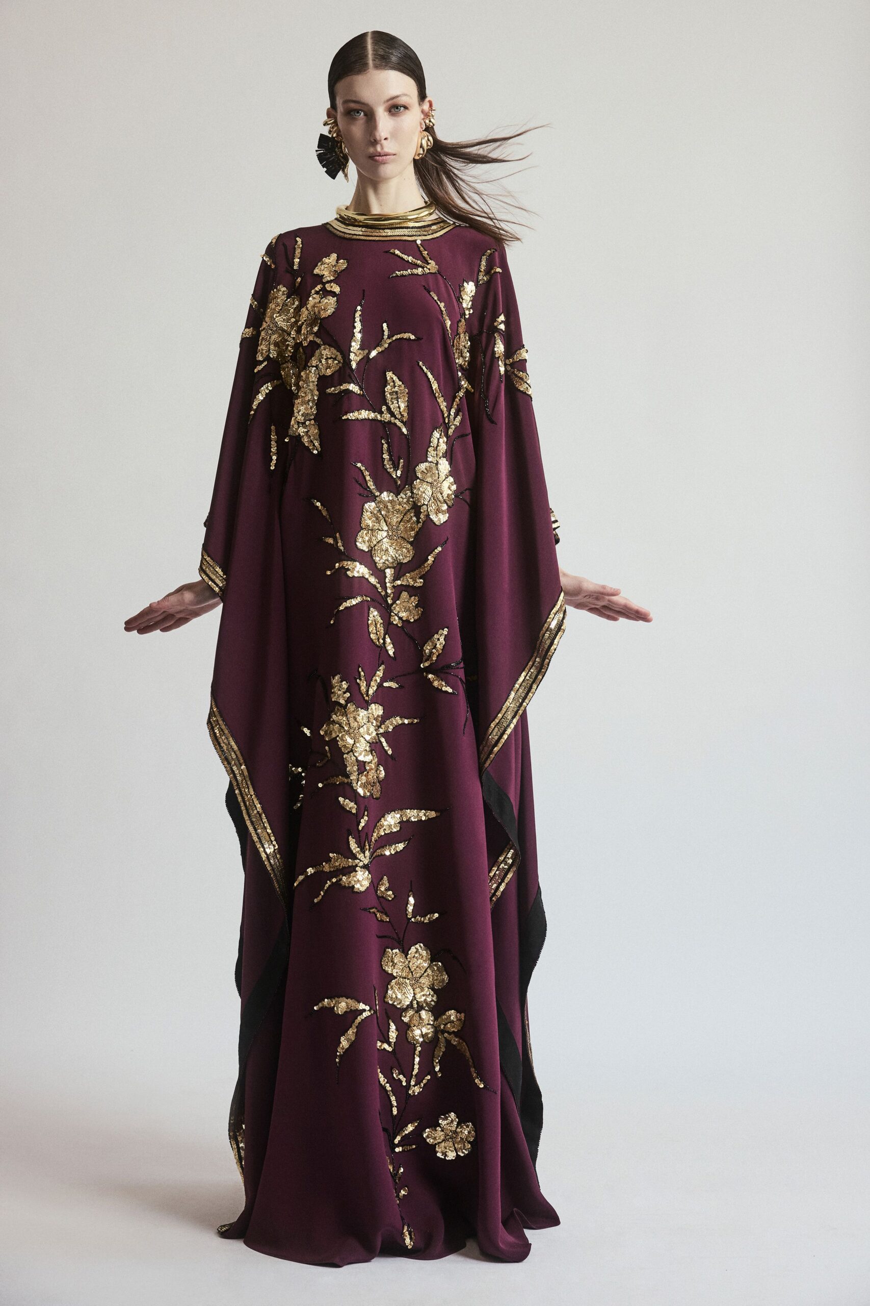 maroon embroidered flowing gown
