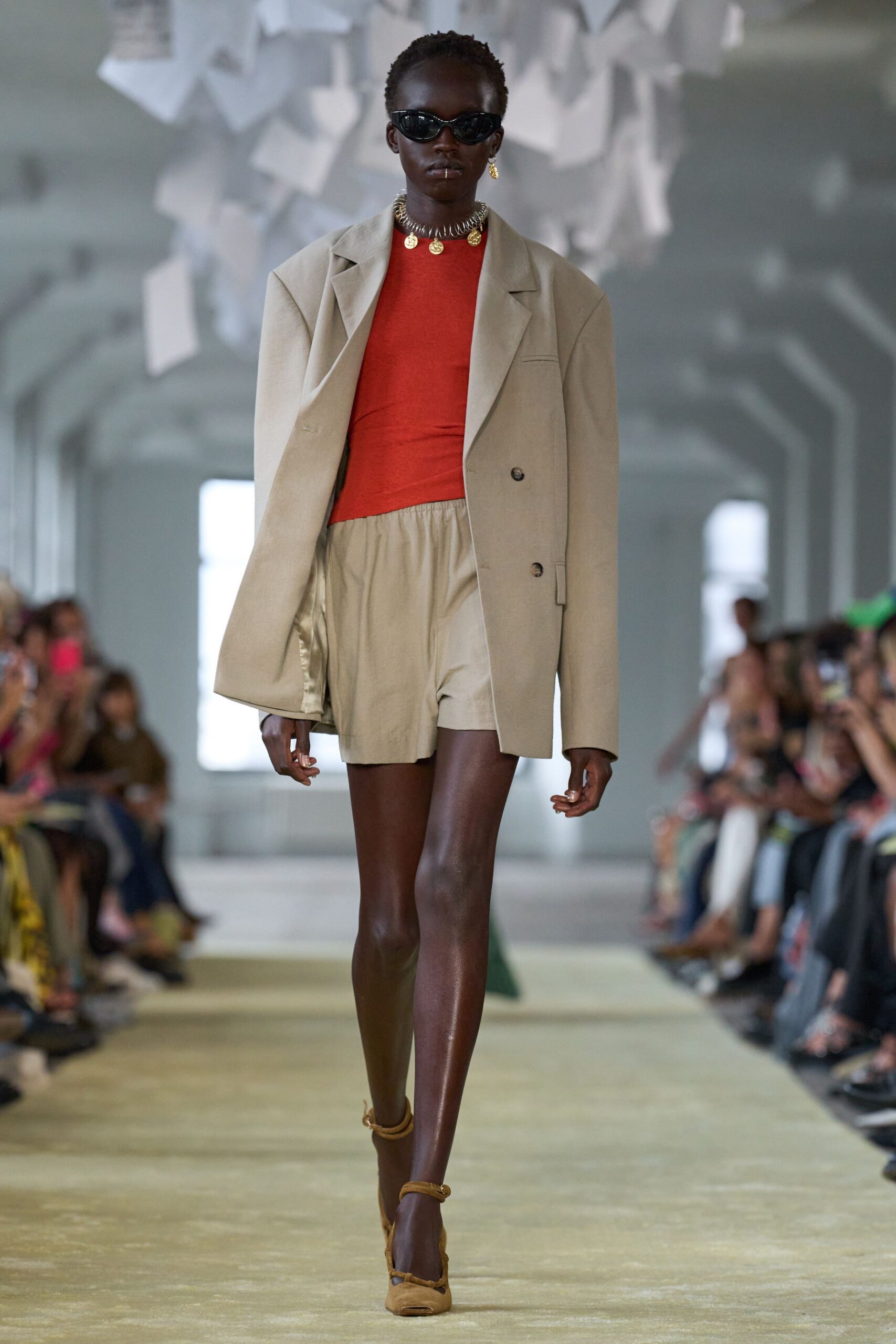 beige blazer red top beige shorts