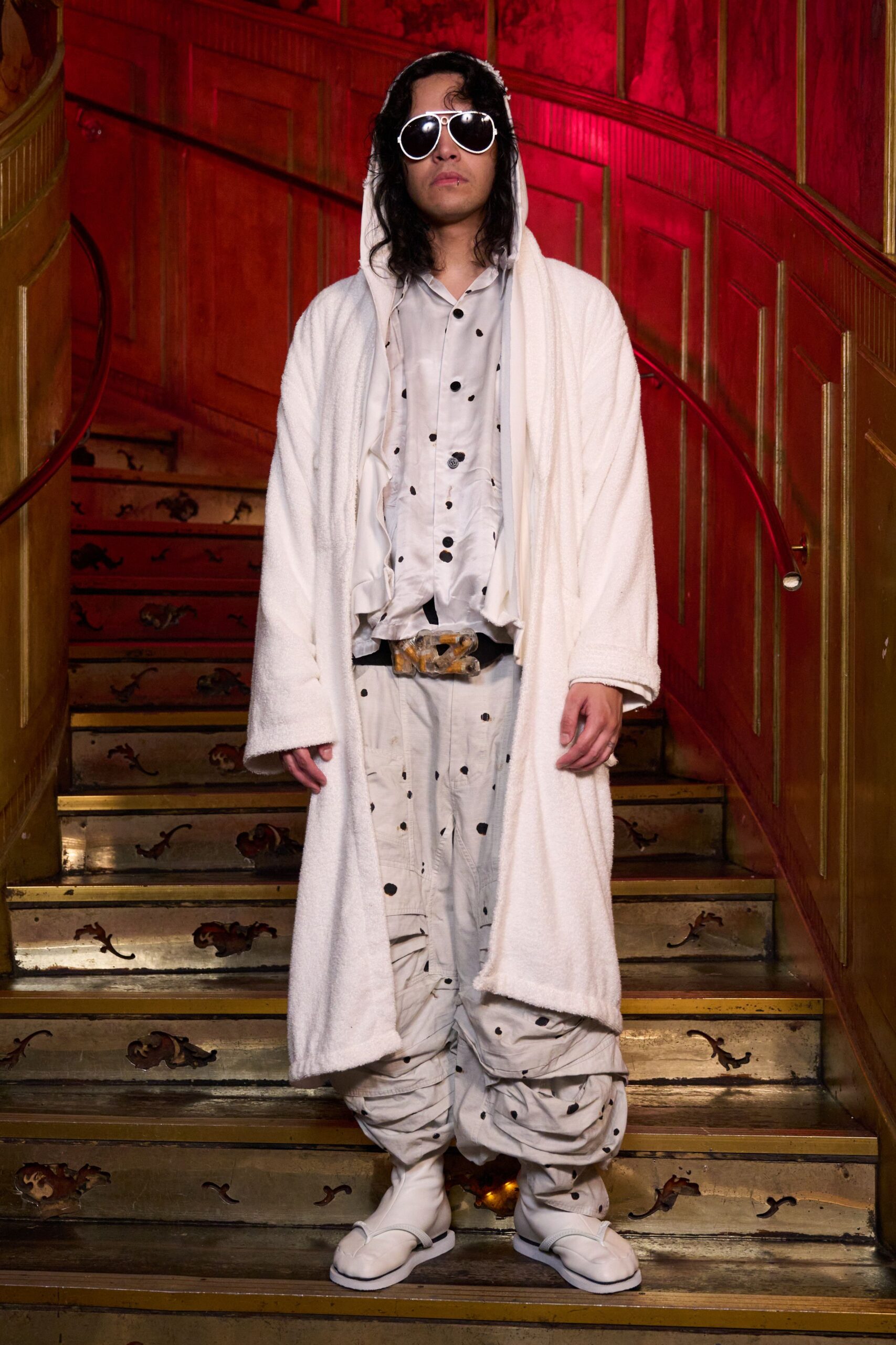 white faux-fur coat with polka-dot shirt