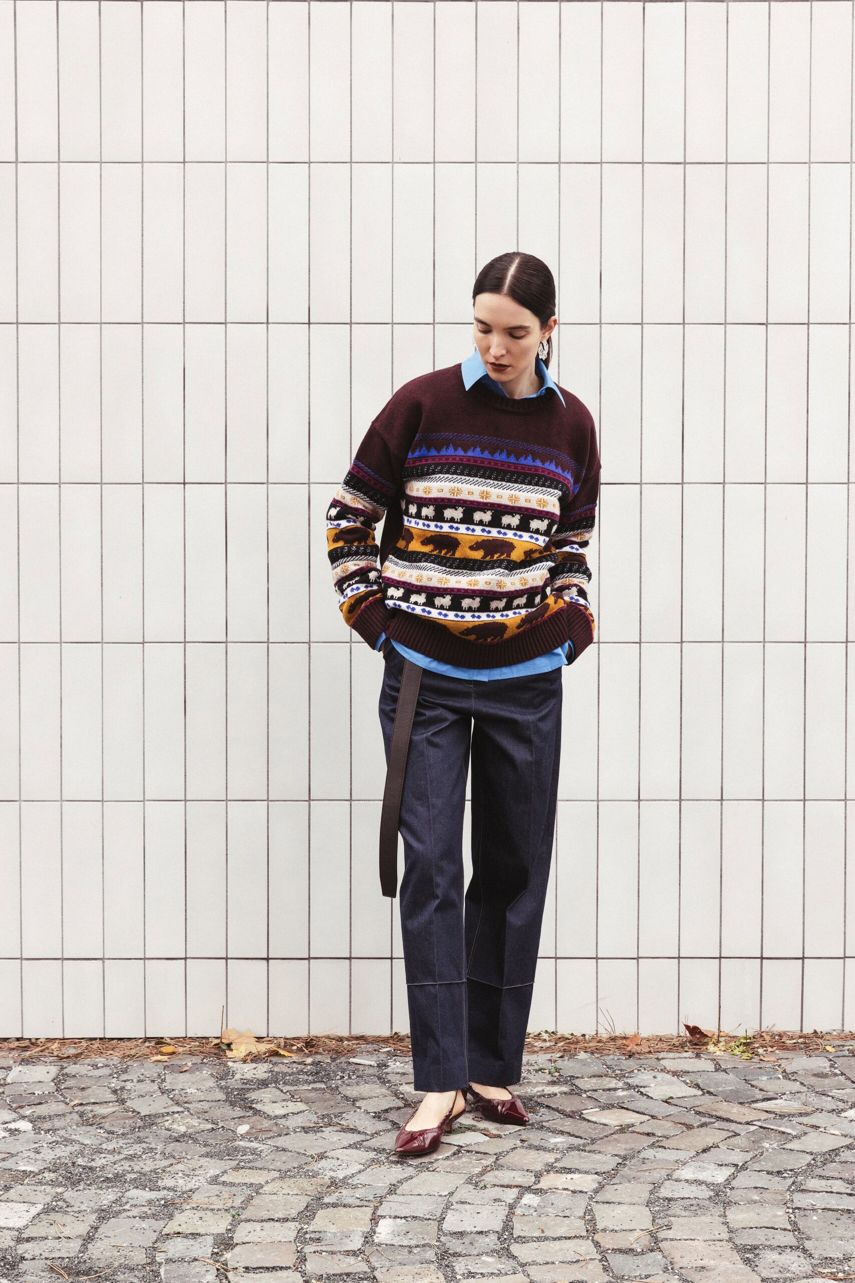 brown multi-striped sweater with tailored pants