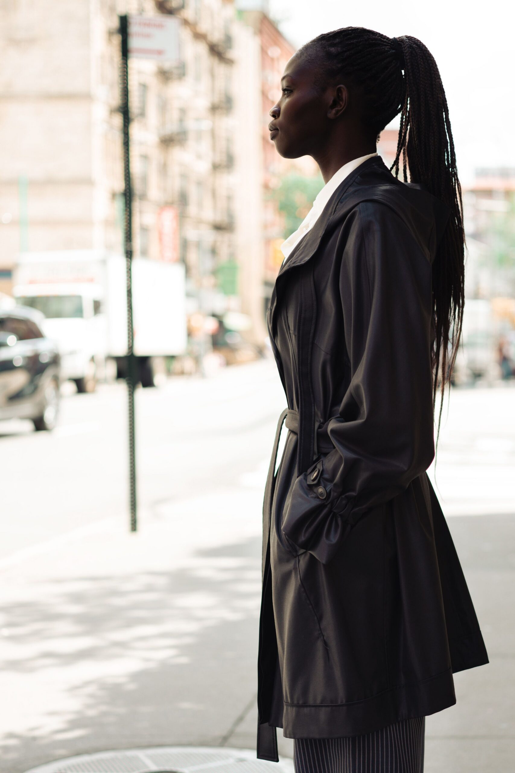 black leather long-sleeve collared fitted belted coat