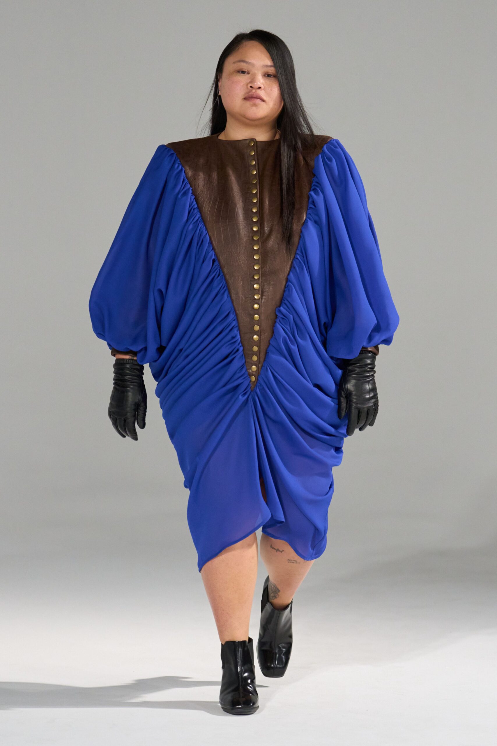 blue draped midi dress with gloves and boots