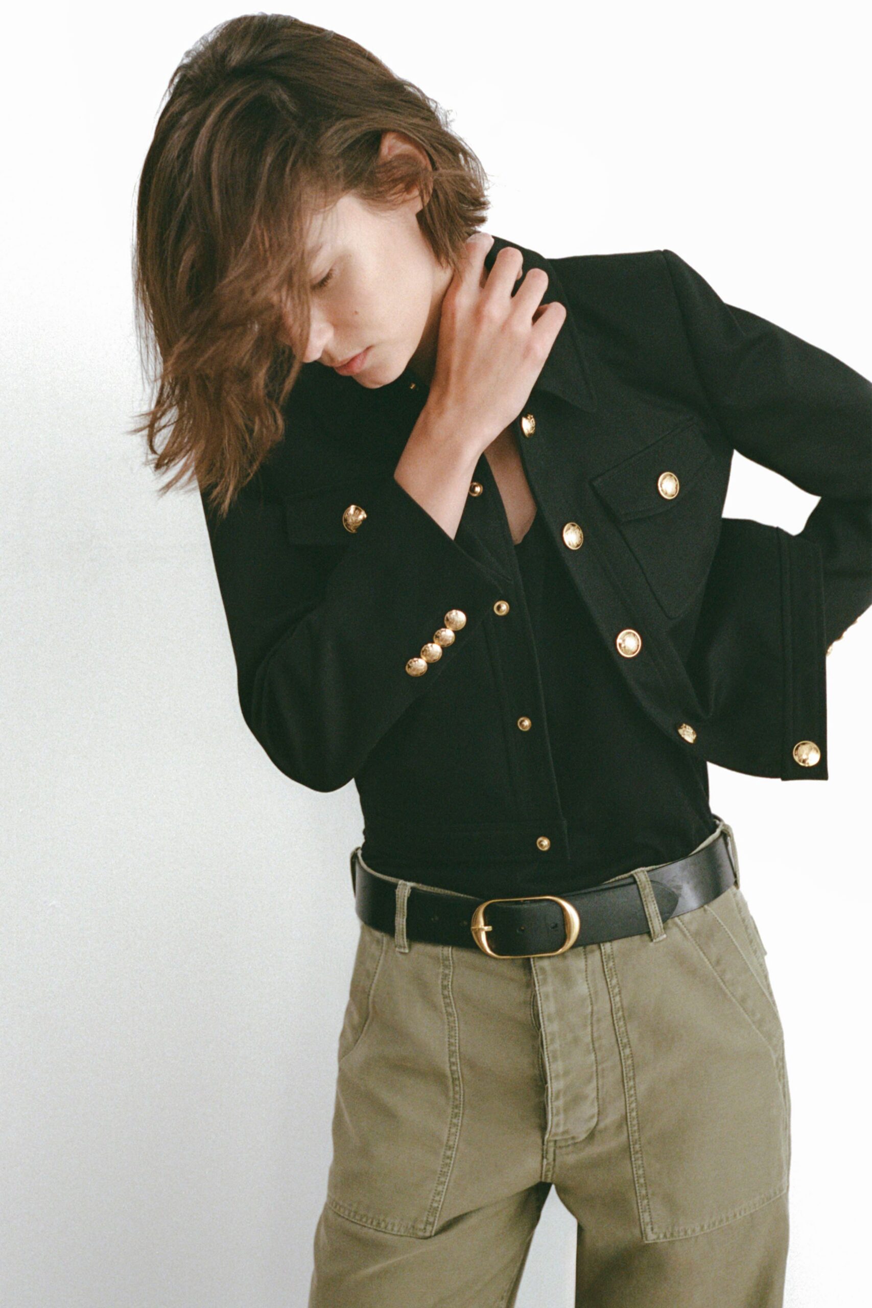 black fitted jacket with green pants