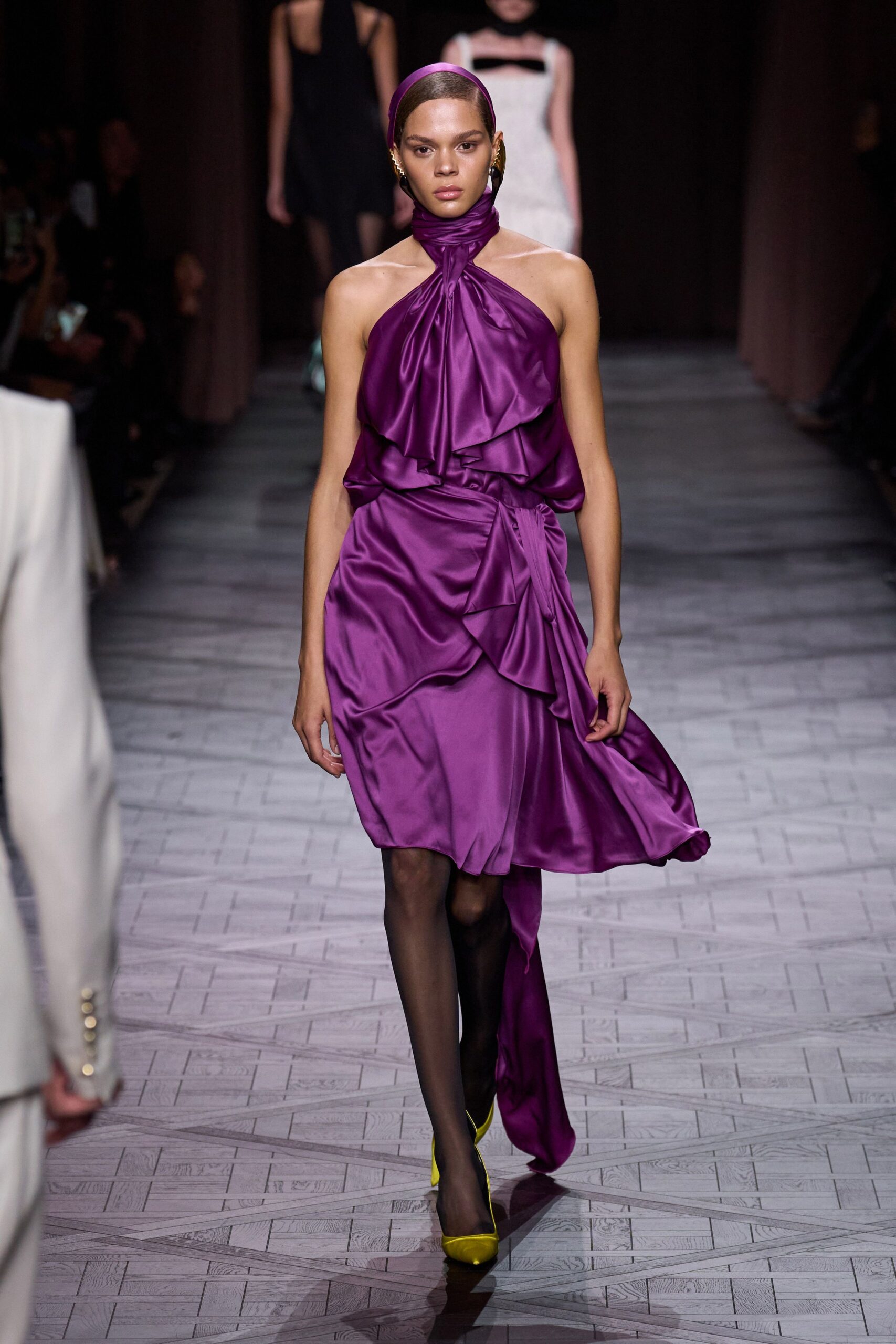 purple silk draped midi dress with yellow shoes